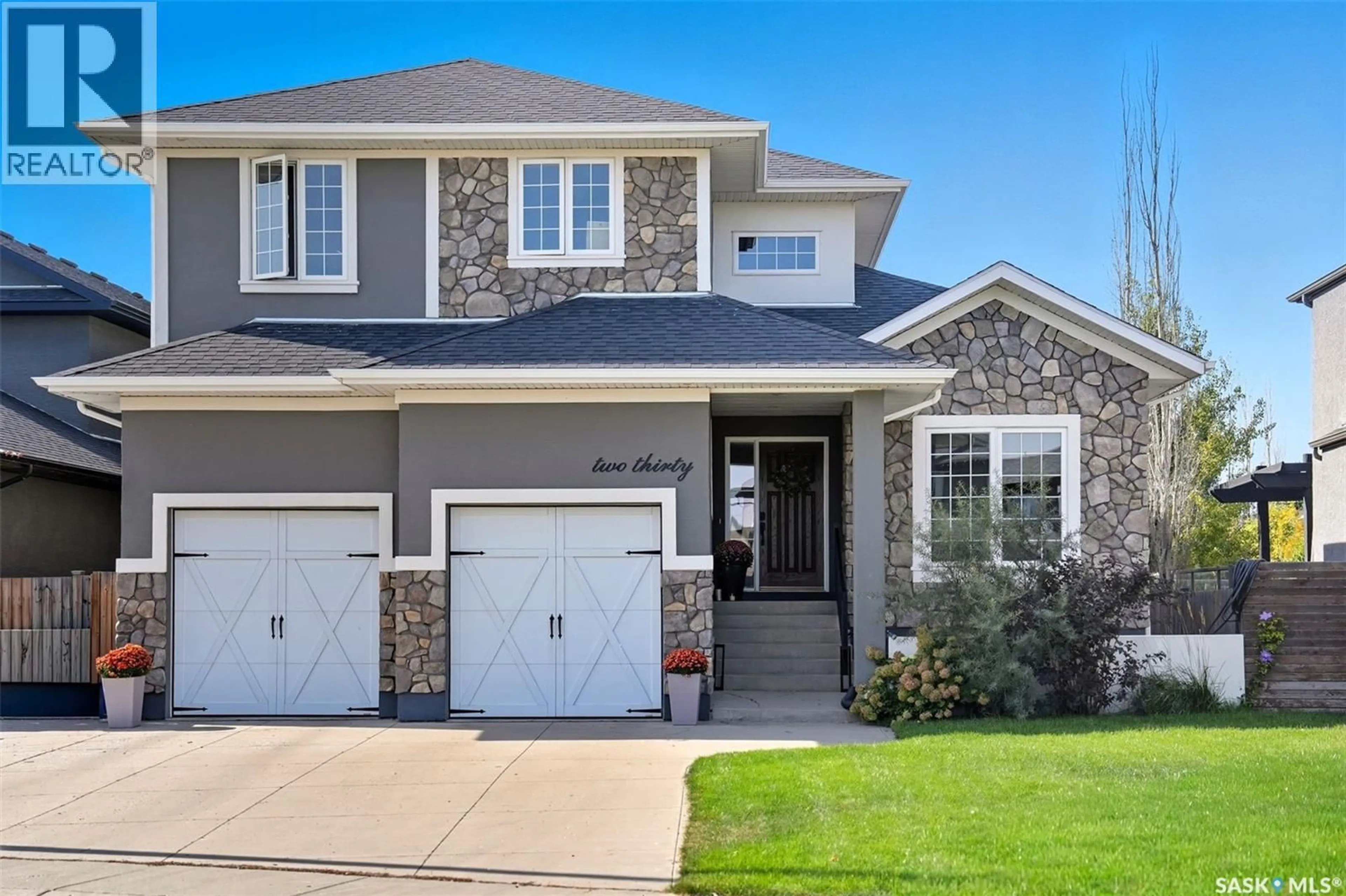 Home with vinyl exterior material, street for 230 TRIMBLE LANE, Saskatoon Saskatchewan S7W0E1