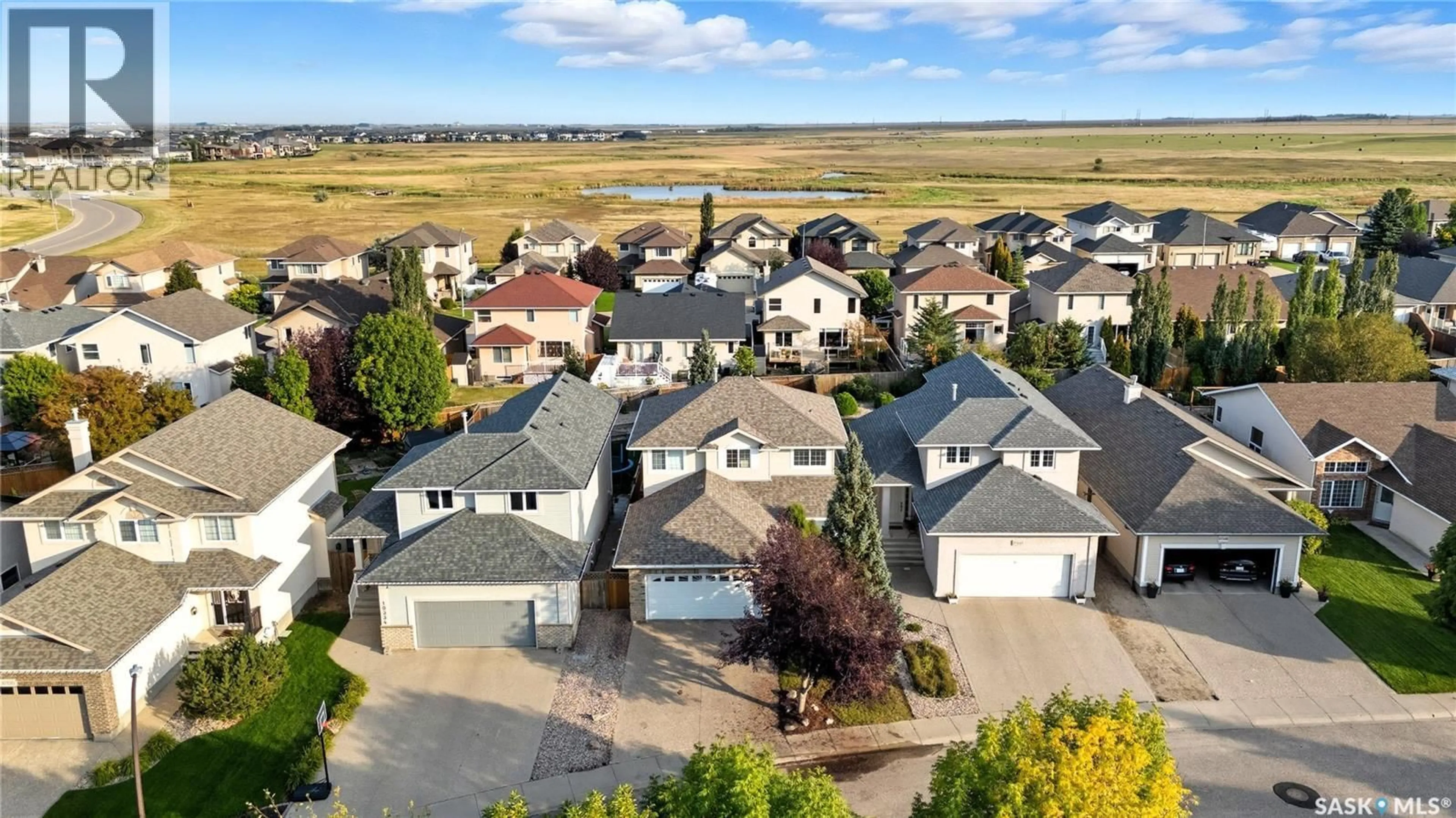 A pic from outside/outdoor area/front of a property/back of a property/a pic from drone, street for 10338 WASCANA ESTATES, Regina Saskatchewan S4V2X1