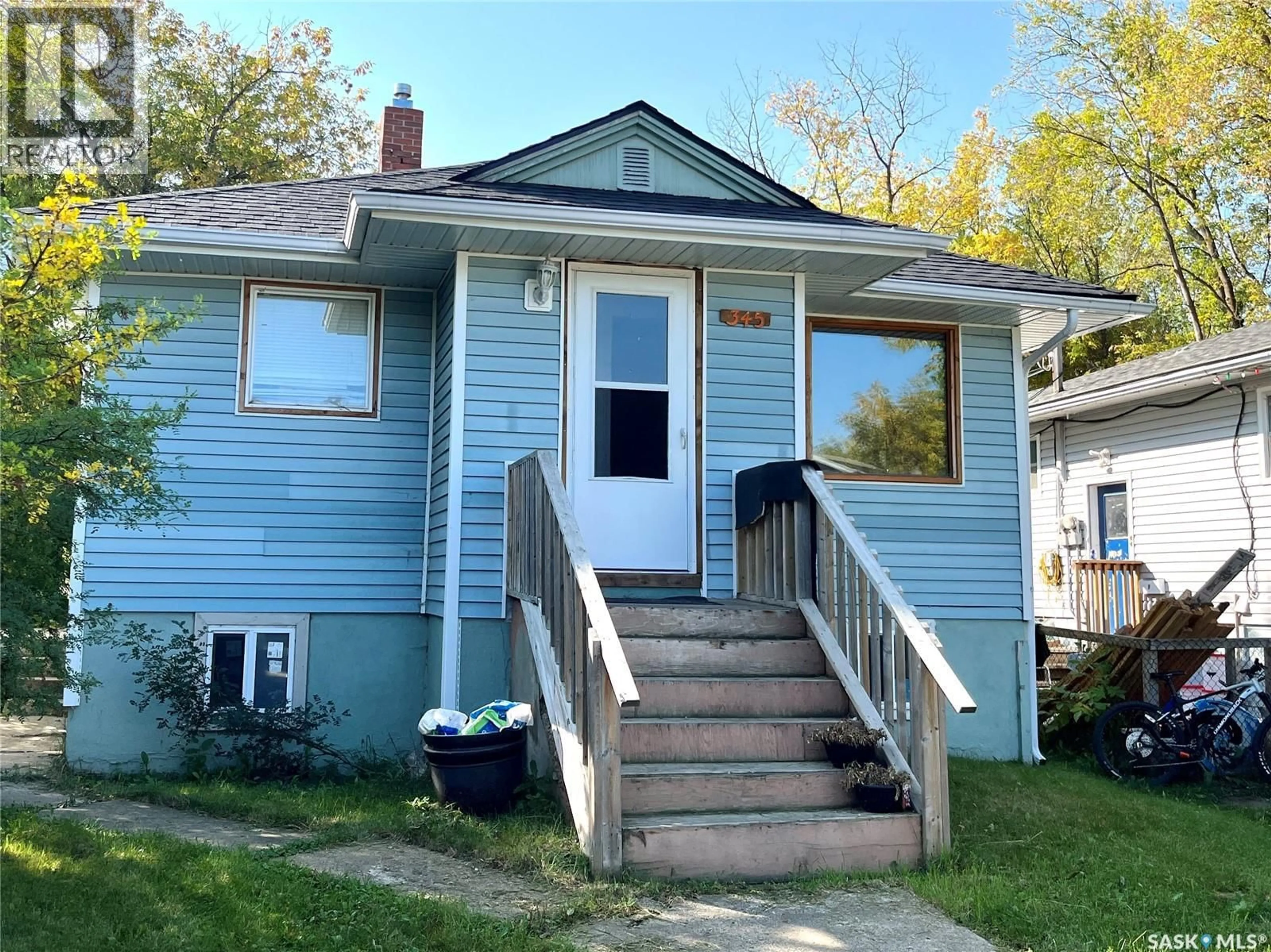 Home with vinyl exterior material, street for 345 19TH STREET, Prince Albert Saskatchewan S6V1J8