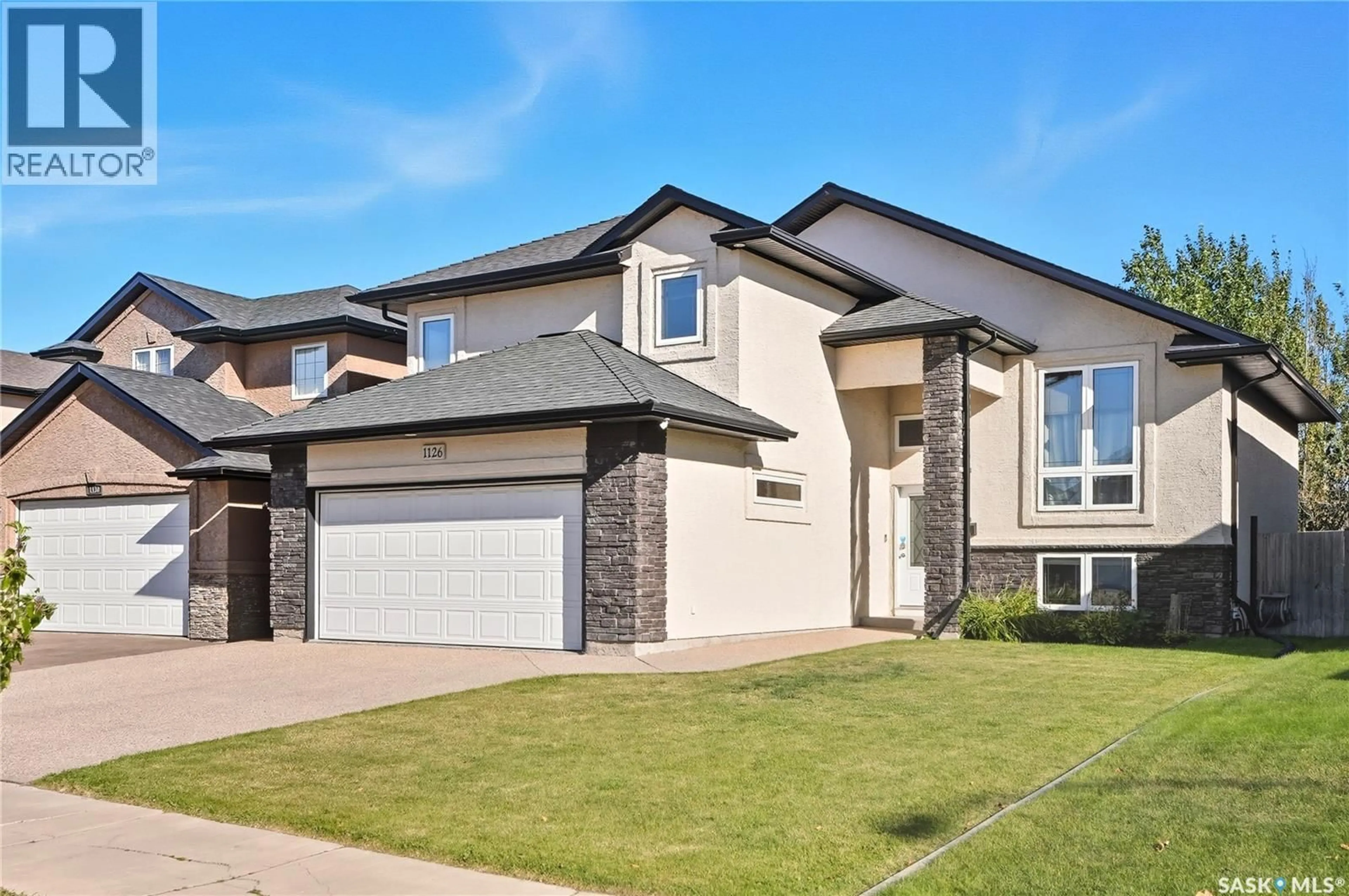 Home with brick exterior material, street for 1126 STENSRUD ROAD, Saskatoon Saskatchewan S7W0B5