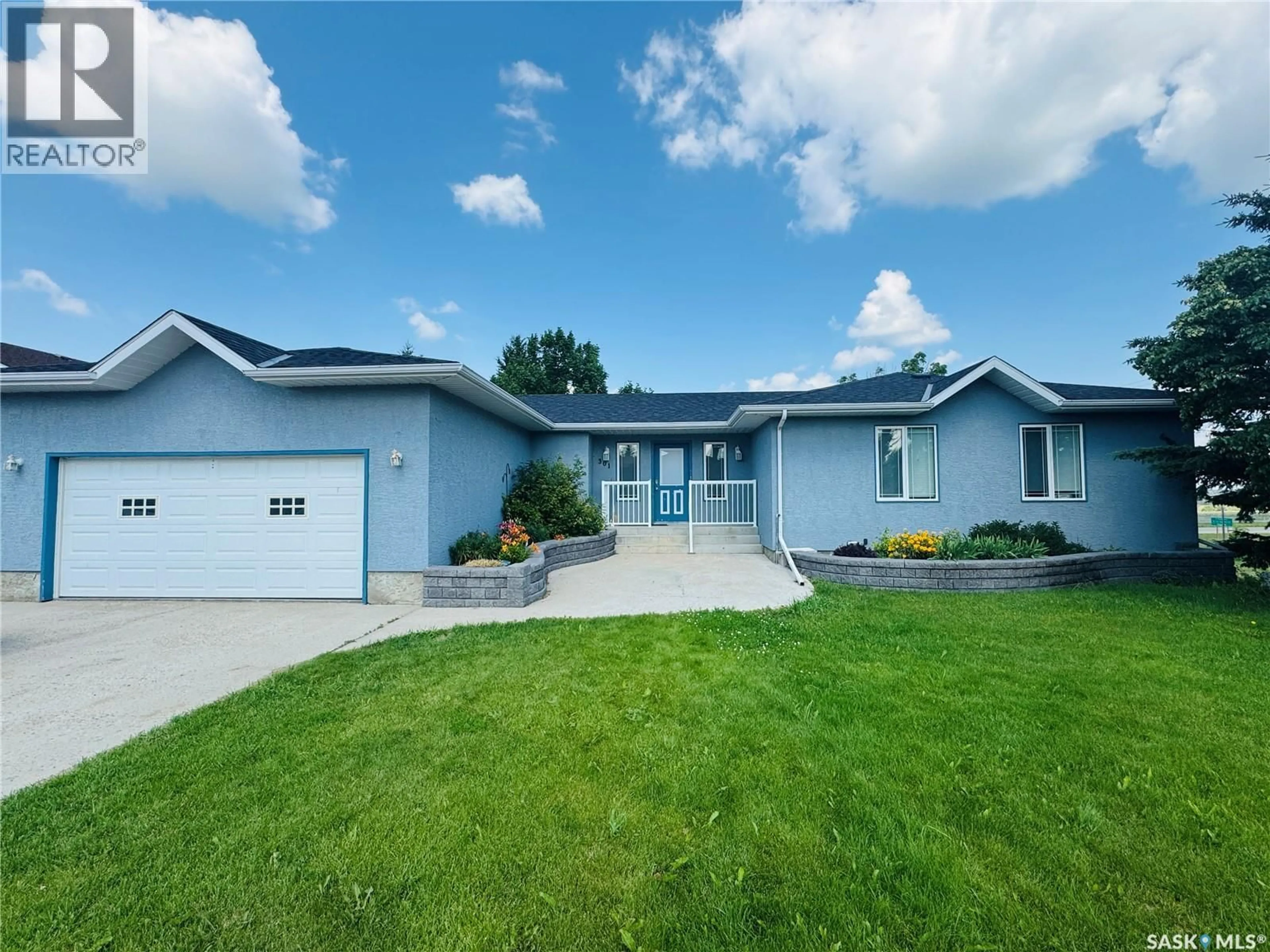 Home with vinyl exterior material, street for 301 TURNBULL AVENUE, Biggar Saskatchewan S0K0M0