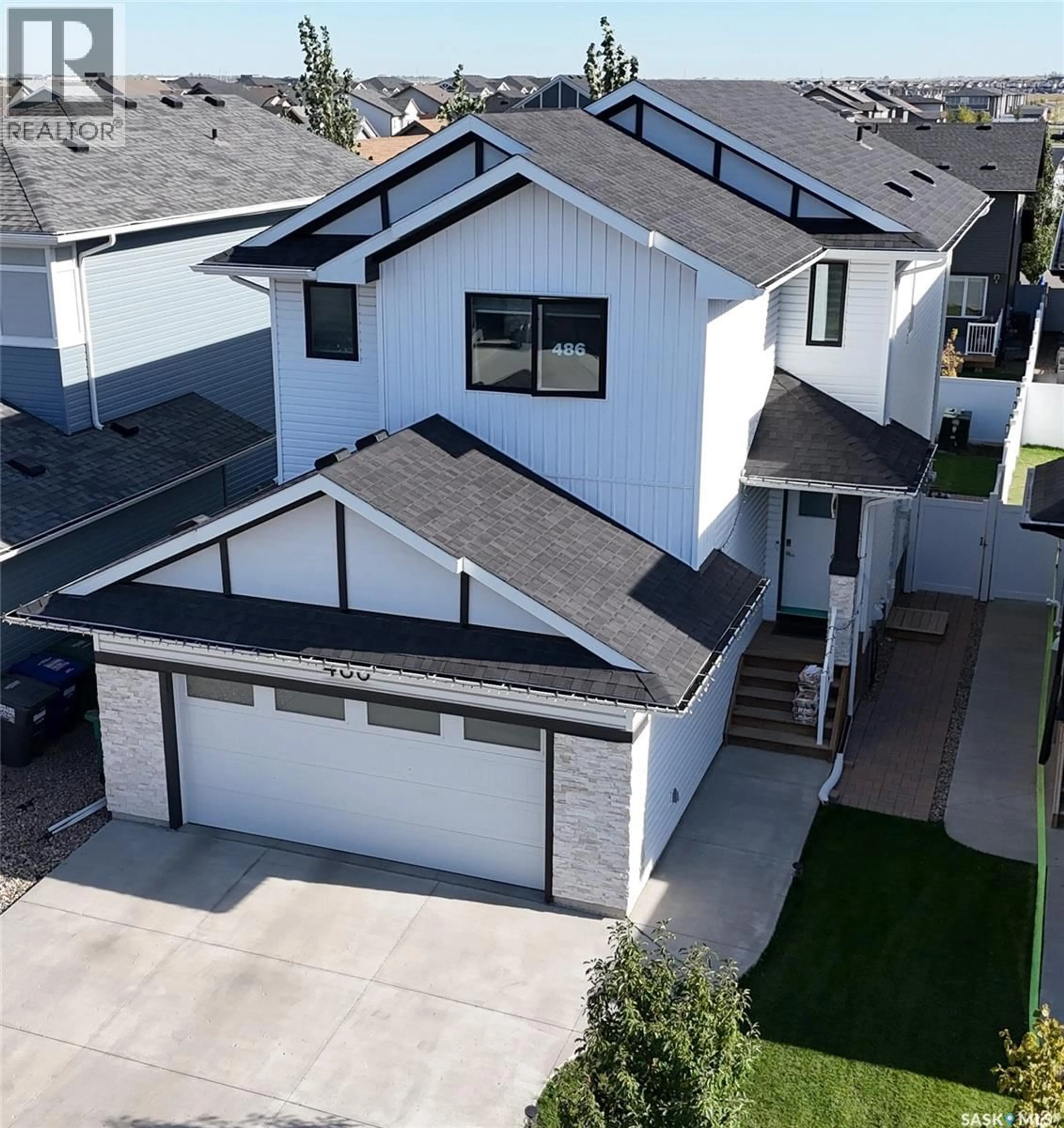 A pic from outside/outdoor area/front of a property/back of a property/a pic from drone, street for 486 MCFAULL CRESCENT, Saskatoon Saskatchewan S7V0T1