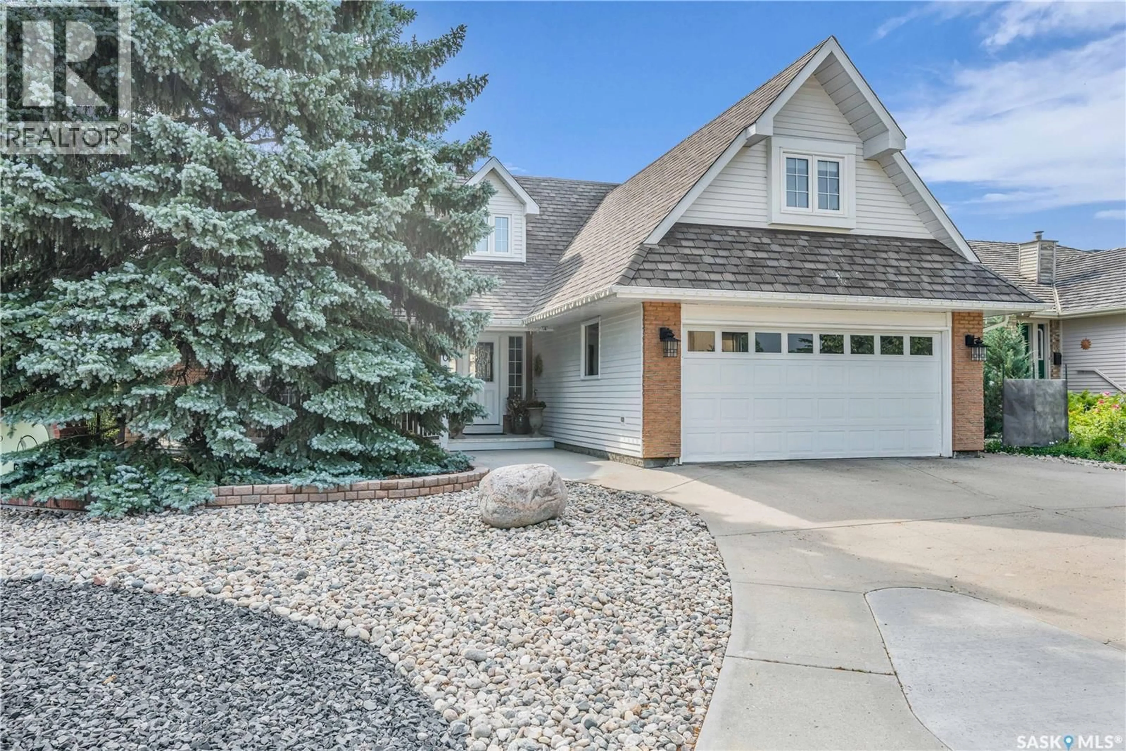 Home with vinyl exterior material, street for 2095 WASCANA GREENS, Regina Saskatchewan S4V2L8