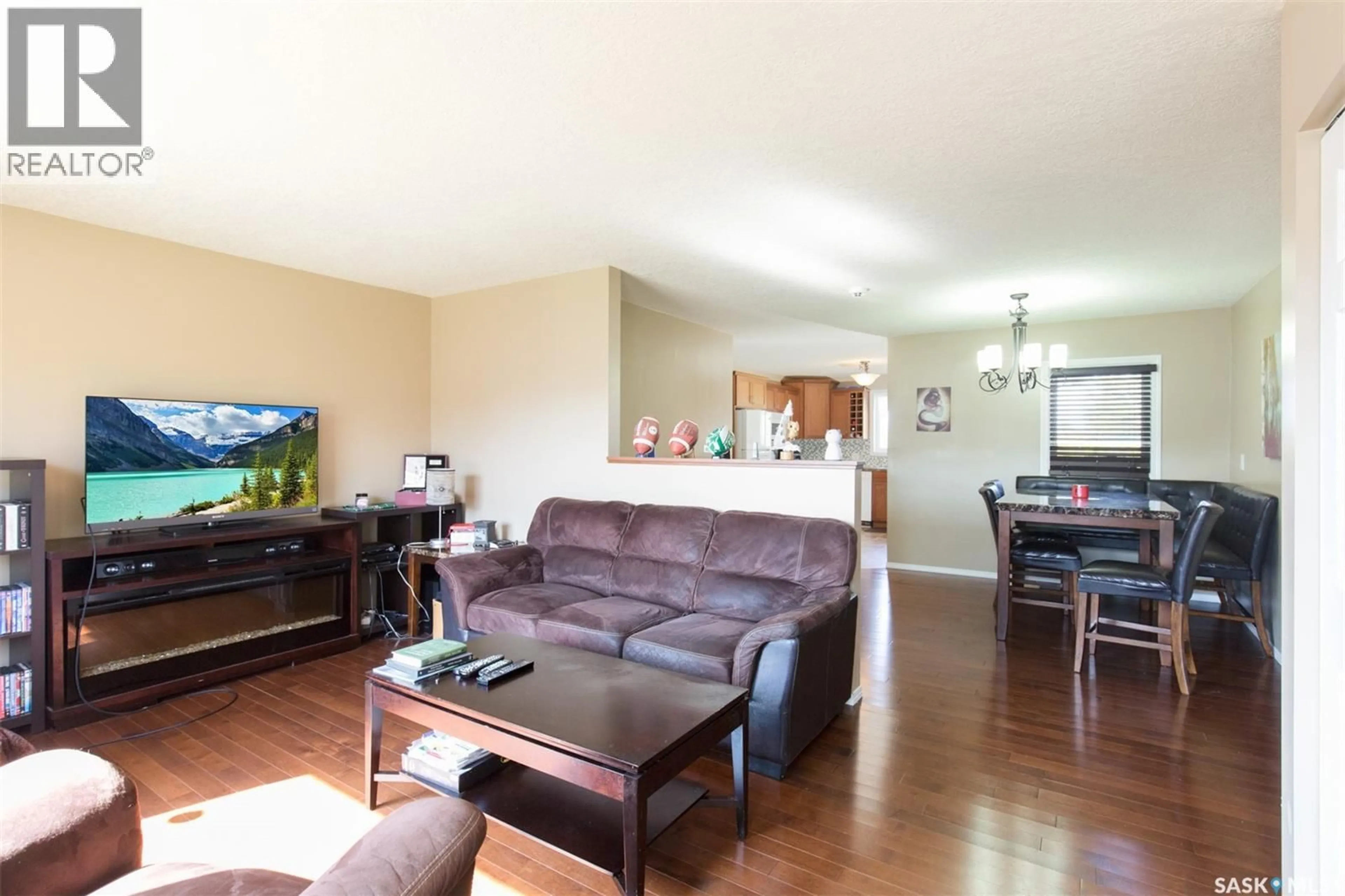 Living room with furniture, wood/laminate floor for 1443 SIOUX CRESCENT, Moose Jaw Saskatchewan S6H7C8