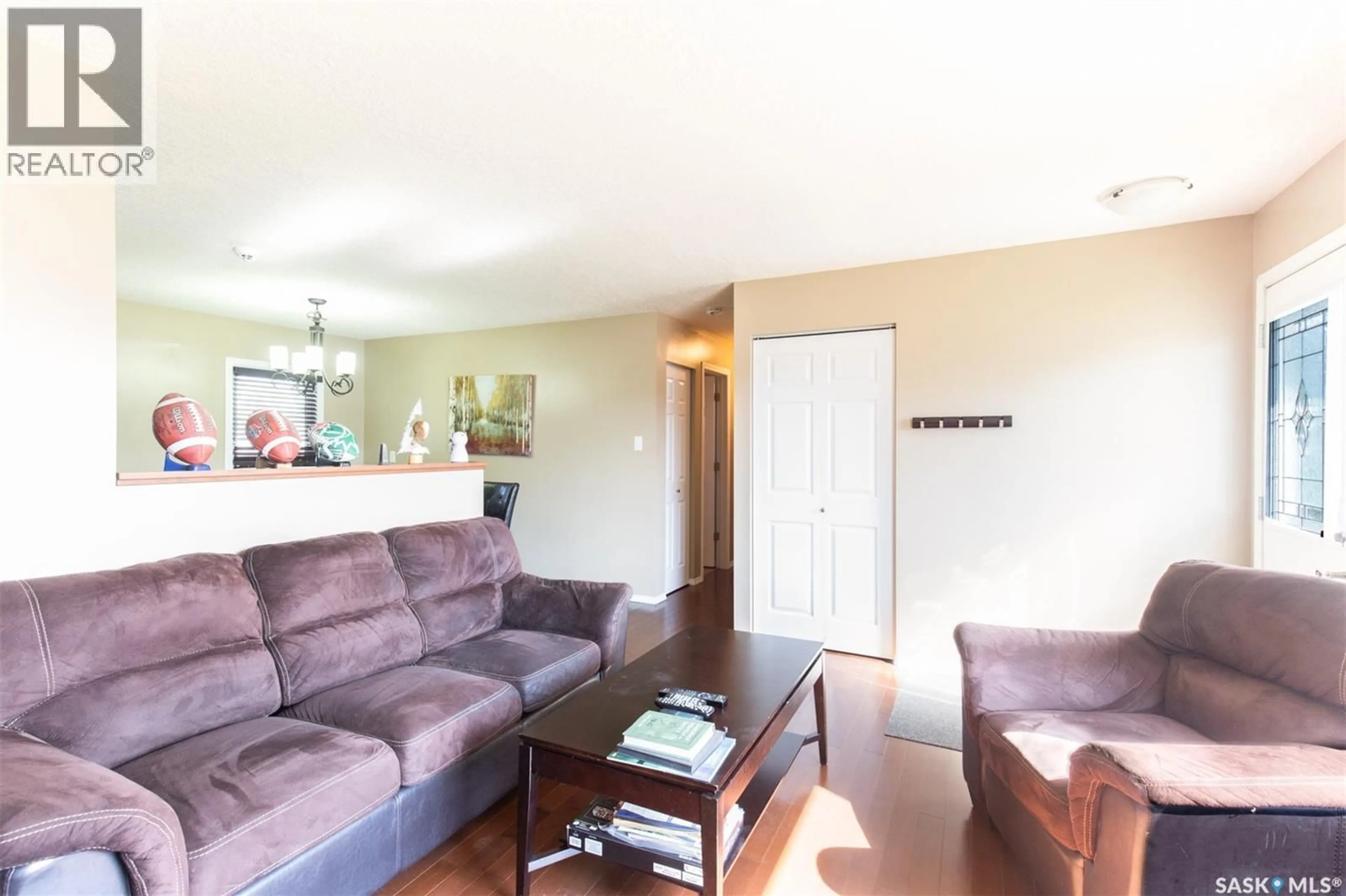 Living room with furniture, wood/laminate floor for 1443 SIOUX CRESCENT, Moose Jaw Saskatchewan S6H7C8