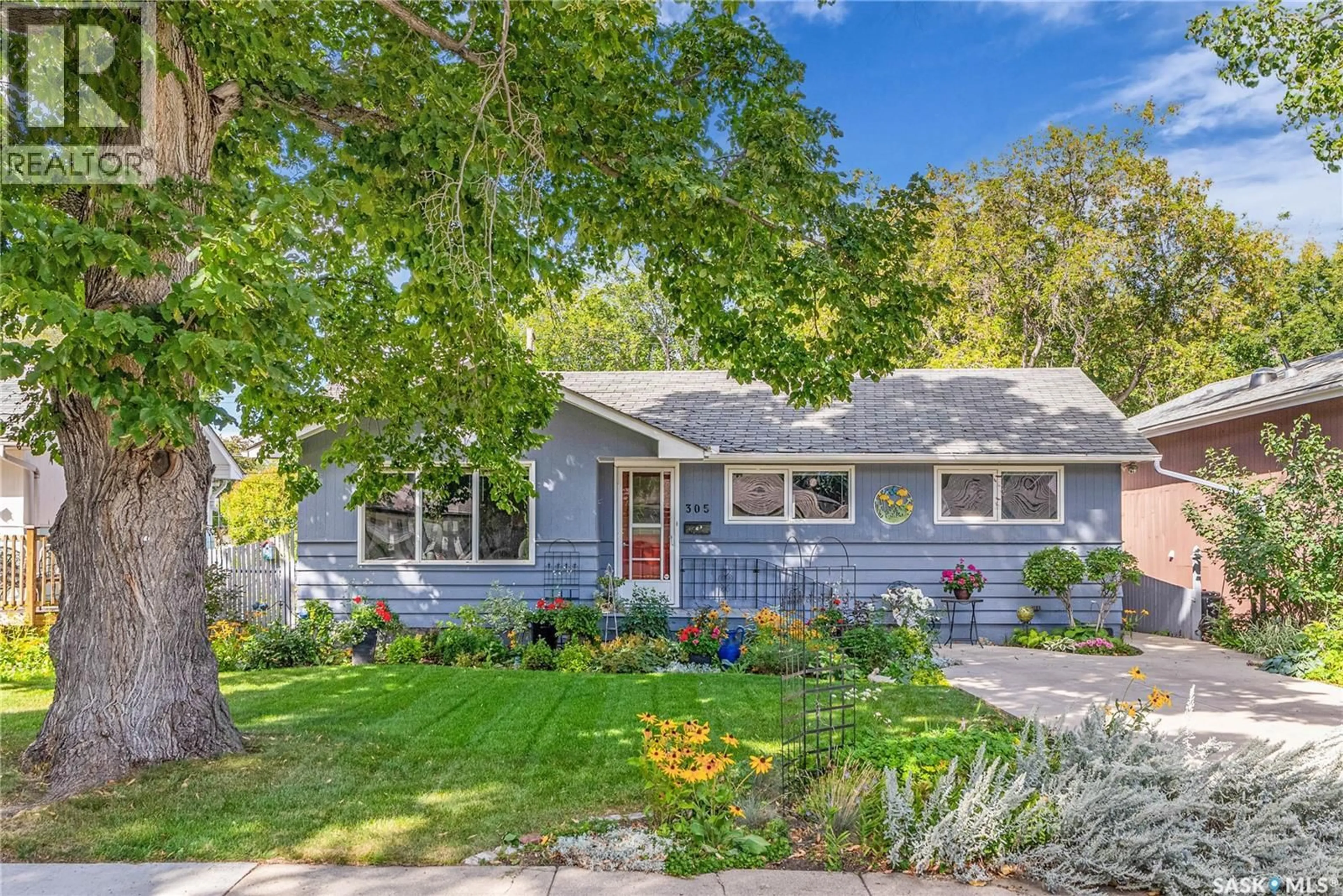 Home with vinyl exterior material, street for 305 ELM STREET, Saskatoon Saskatchewan S7J0G9