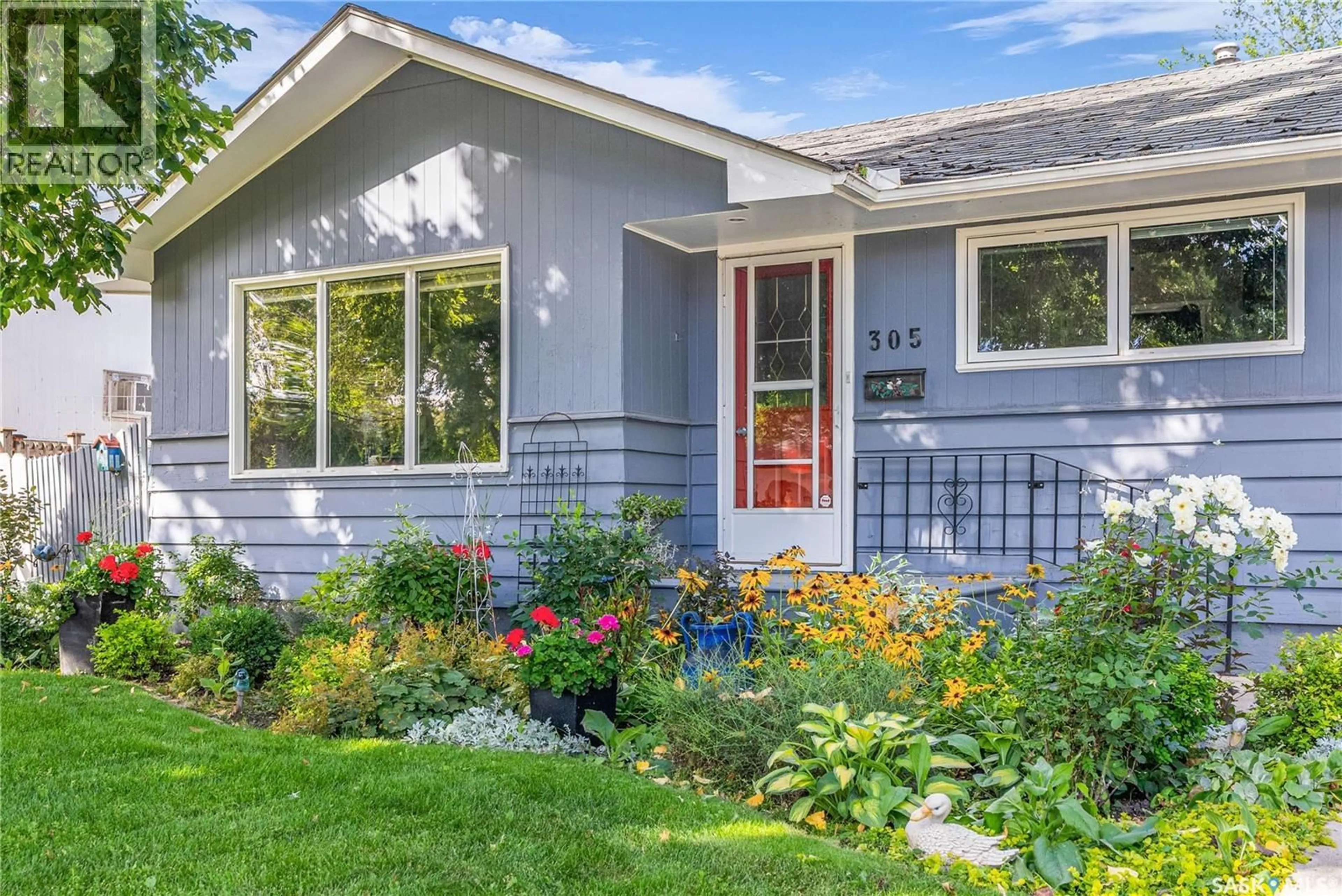 Home with vinyl exterior material, street for 305 ELM STREET, Saskatoon Saskatchewan S7J0G9