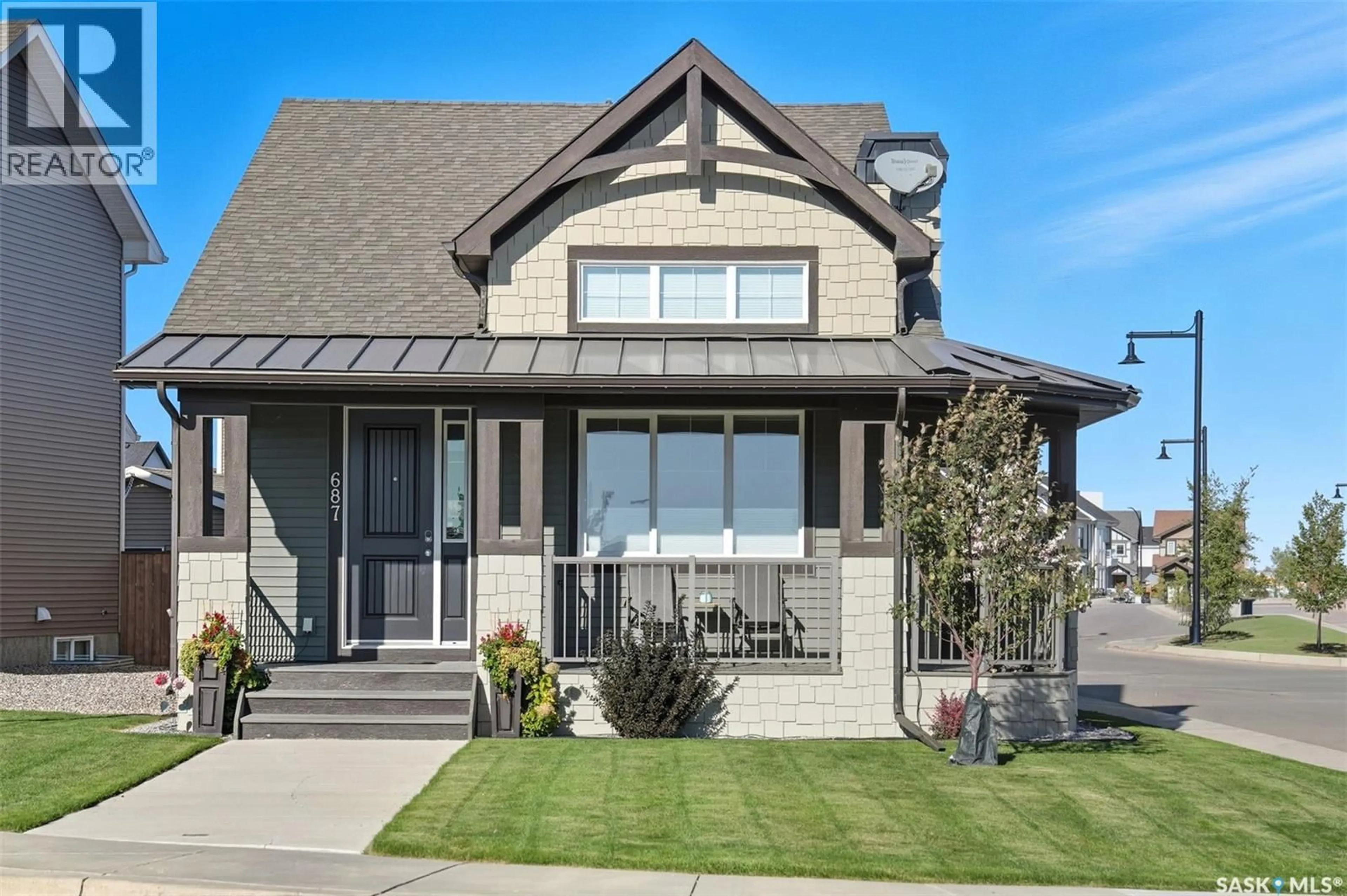 Home with vinyl exterior material, street for 687 SECORD BEND, Saskatoon Saskatchewan S7V0M7