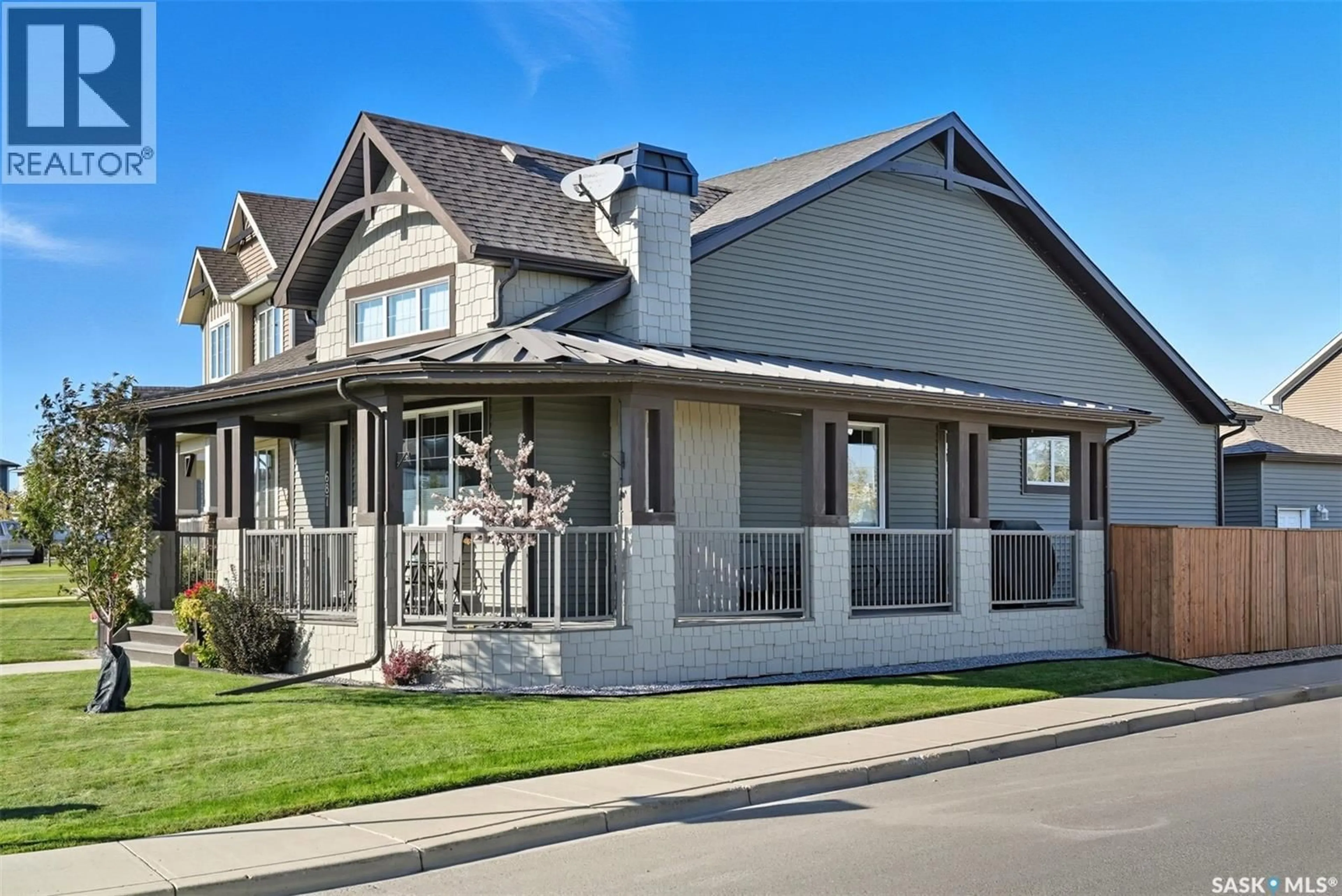 Home with vinyl exterior material, street for 687 SECORD BEND, Saskatoon Saskatchewan S7V0M7