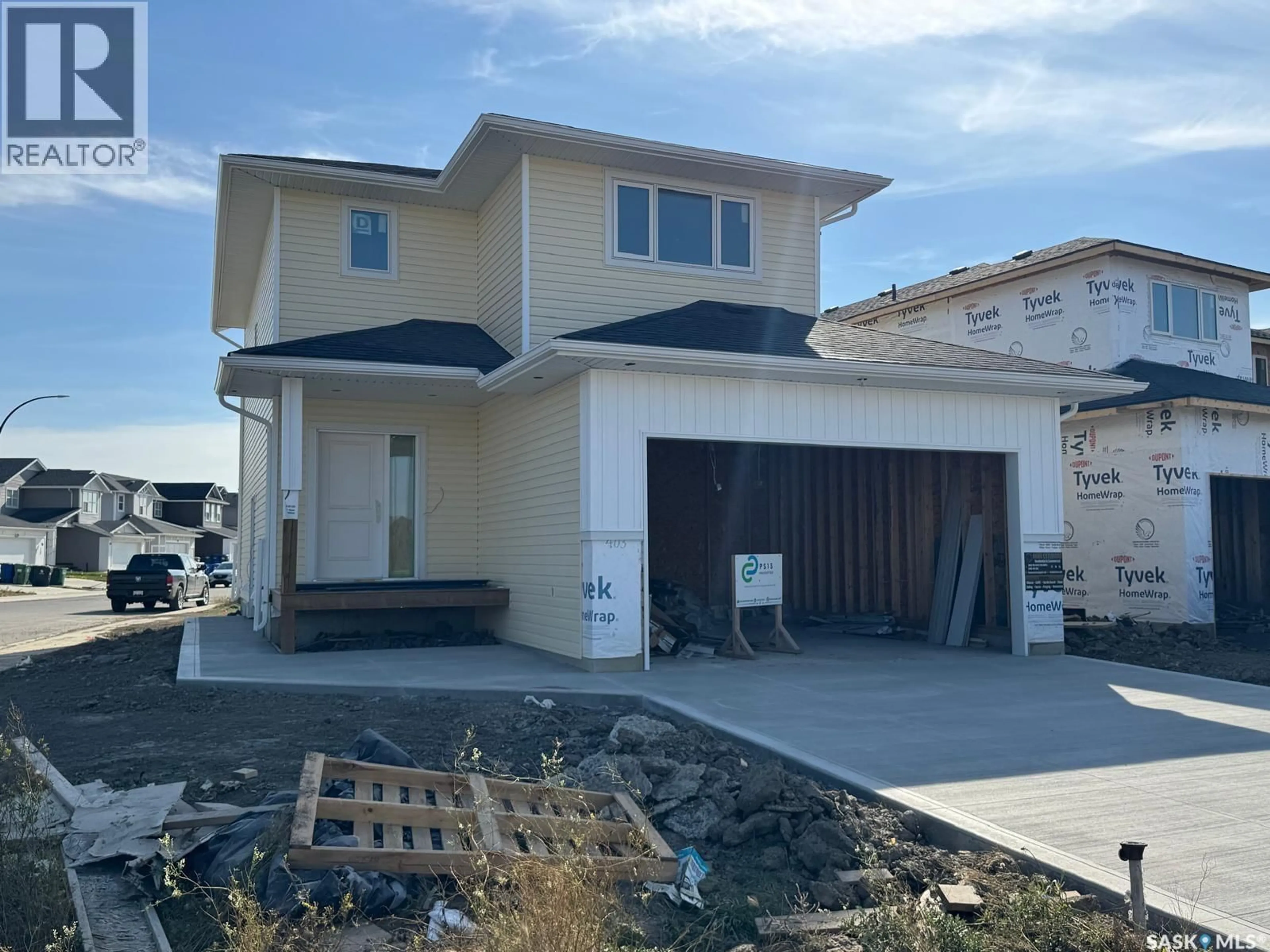 Home with vinyl exterior material, street for 403 STROMBERG CRESCENT, Saskatoon Saskatchewan S7L7P1