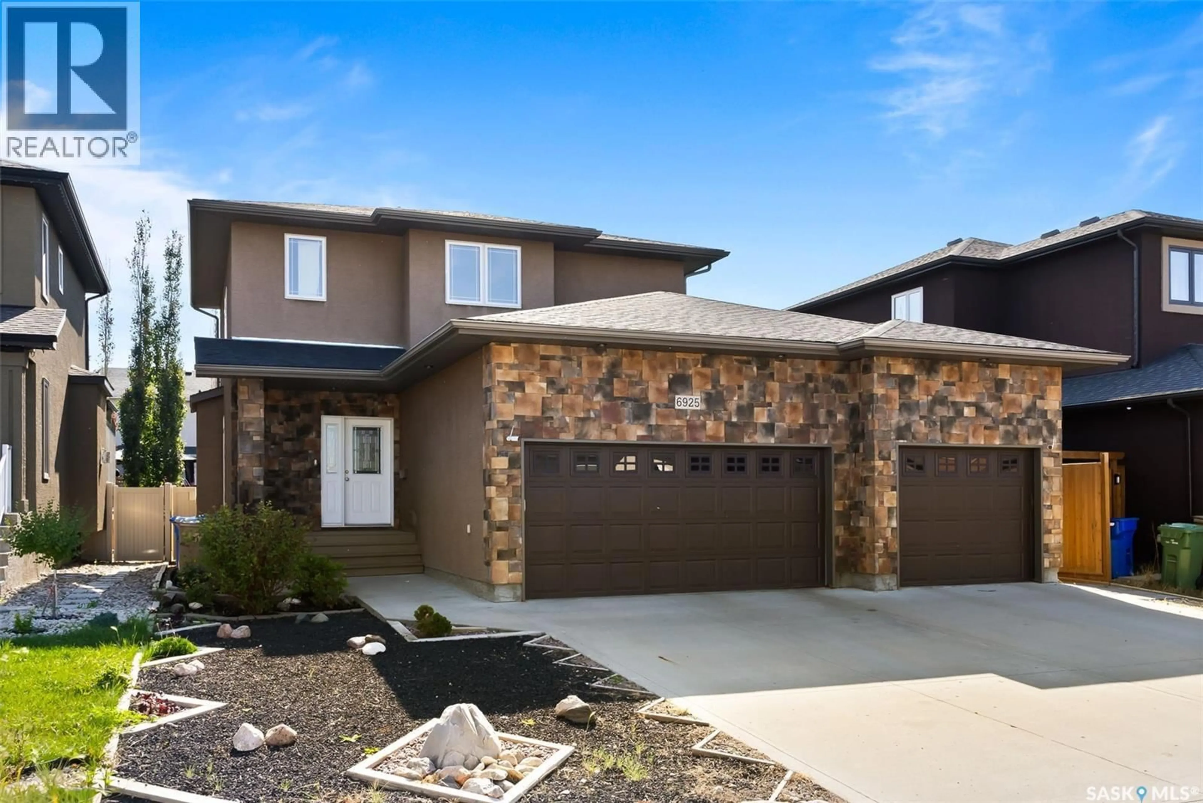 Home with brick exterior material, street for 6925 MAPLE RIDGE DRIVE, Regina Saskatchewan S4X4J2