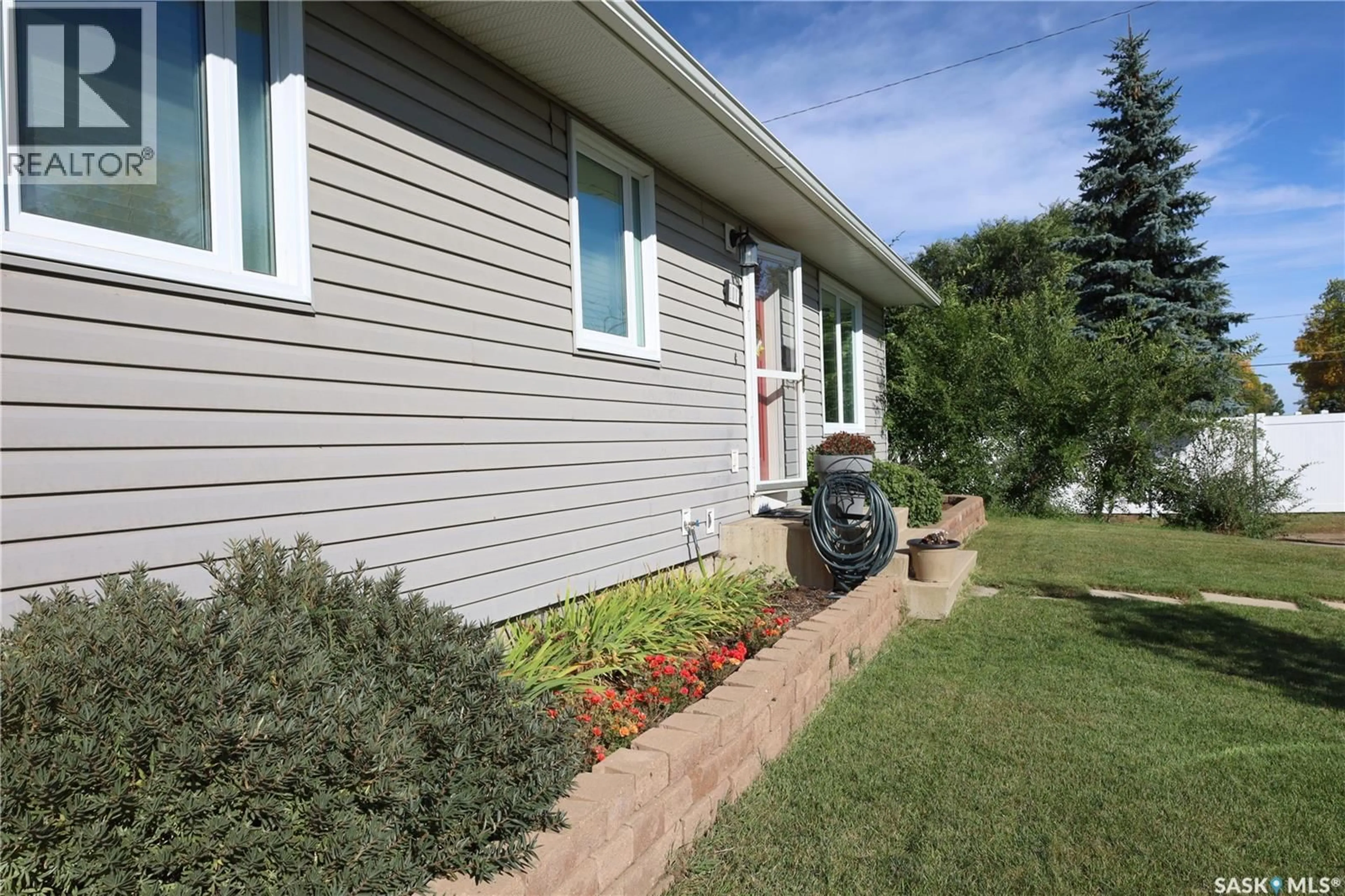 Home with vinyl exterior material, street for 101 3RD STREET, Langham Saskatchewan S0K2K0