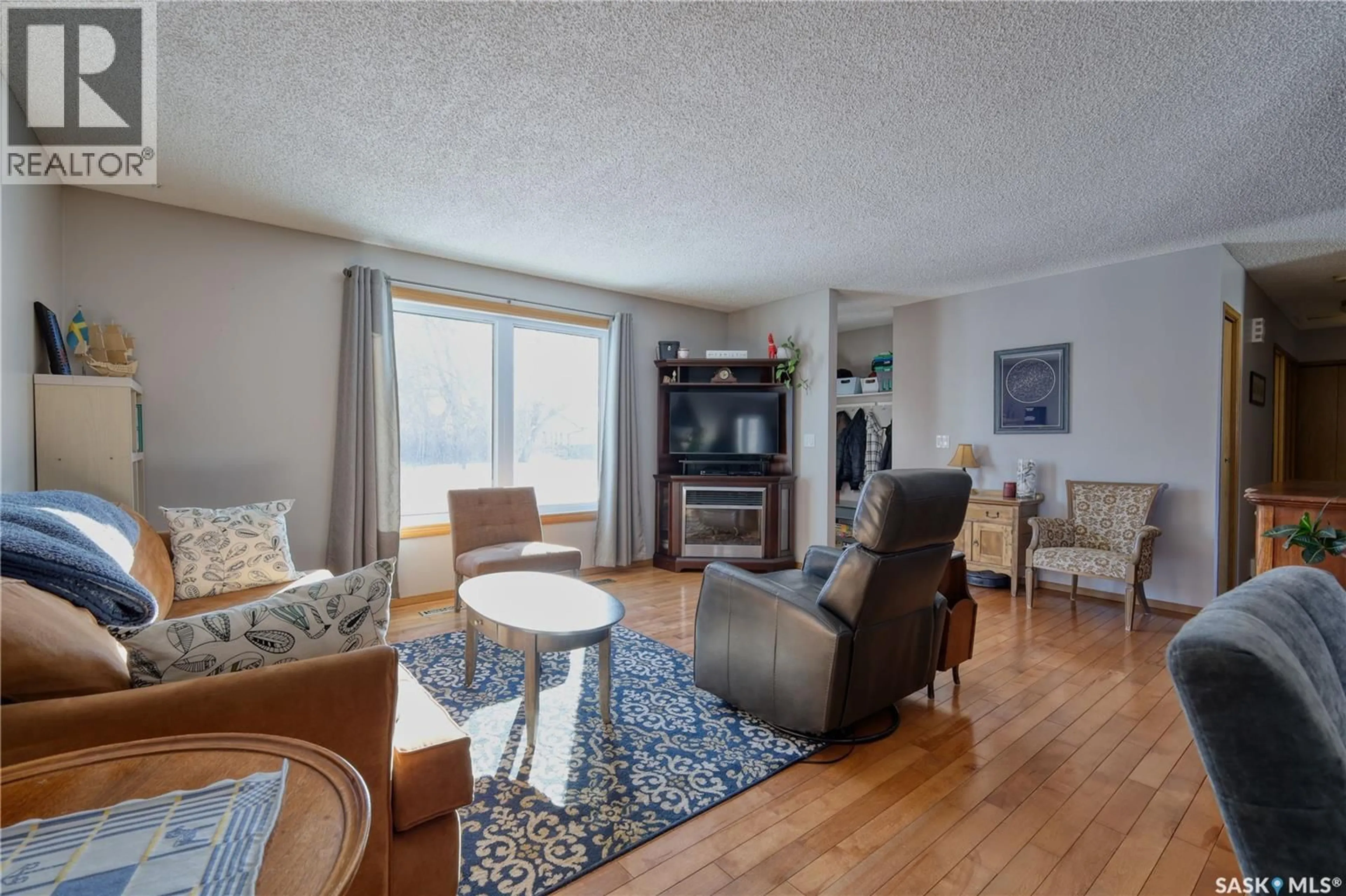 Living room with furniture, wood/laminate floor for 101 3RD STREET, Langham Saskatchewan S0K2K0