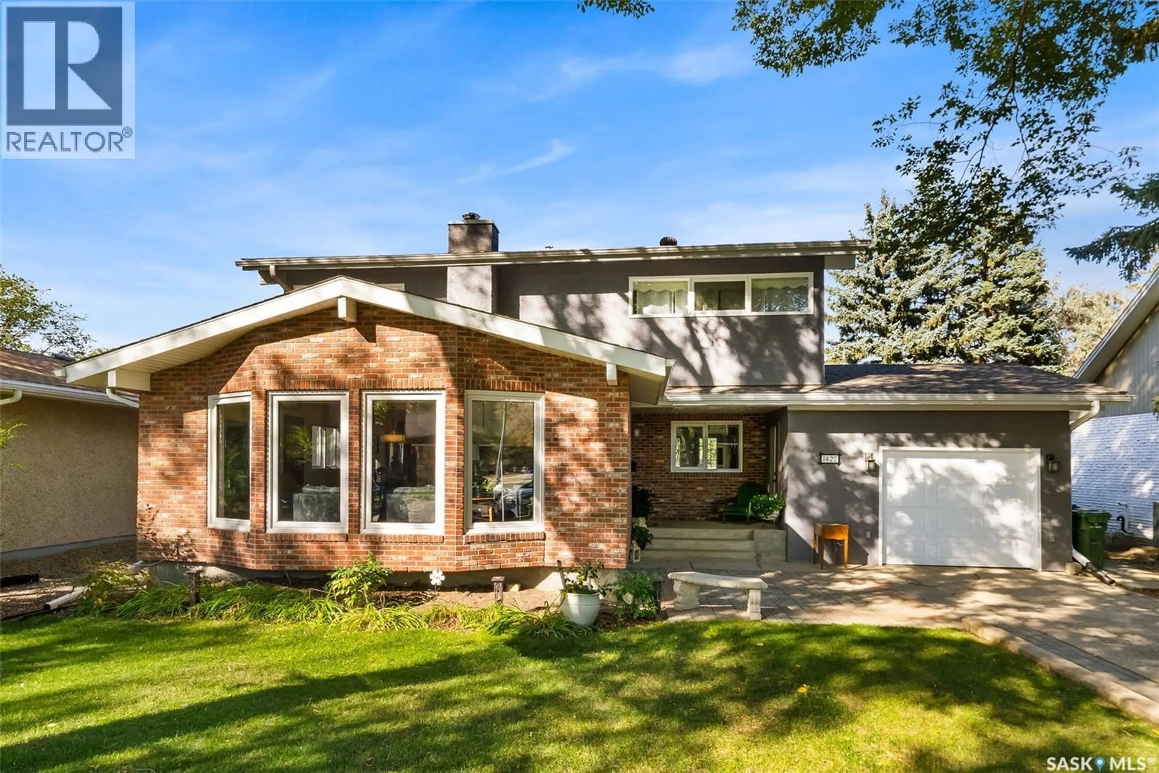 Home with brick exterior material, street for 1422 UHRICH AVENUE, Regina Saskatchewan S4S3R7