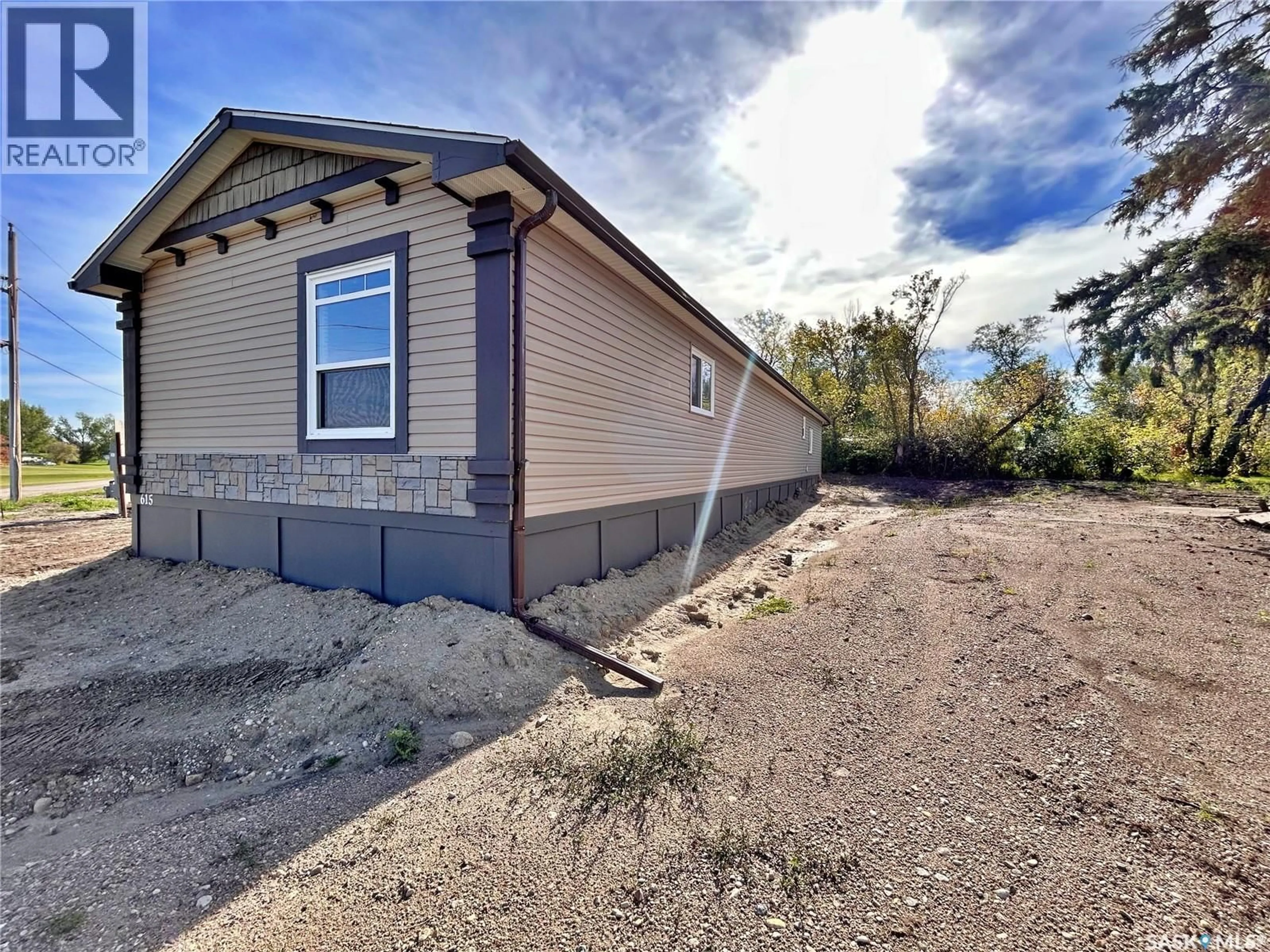 Home with vinyl exterior material, street for 615 KING STREET, Wapella Saskatchewan S0G4Z0