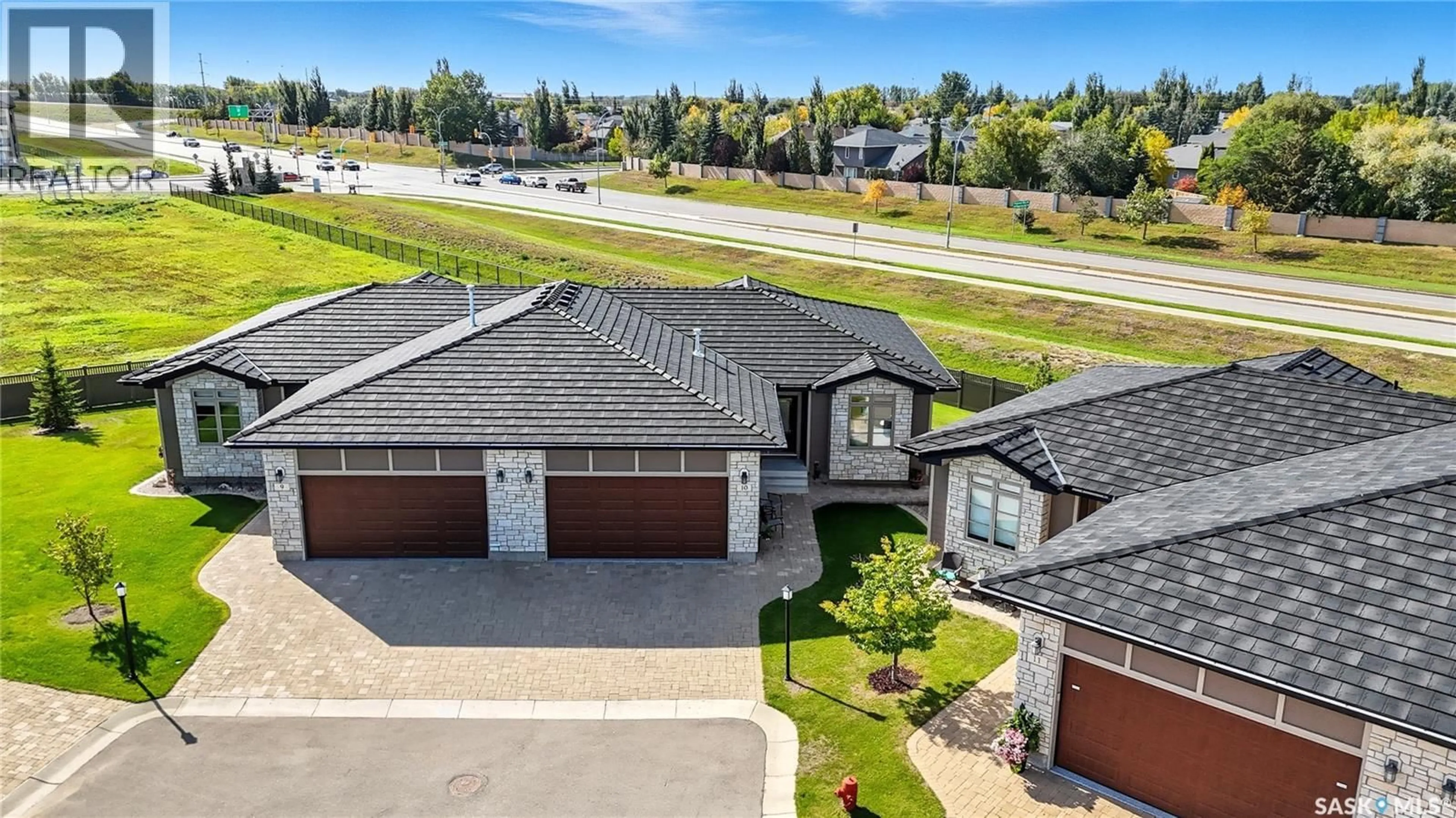 A pic from outside/outdoor area/front of a property/back of a property/a pic from drone, street for 315 - 10 LEDINGHAM DRIVE, Saskatoon Saskatchewan S7V0J1
