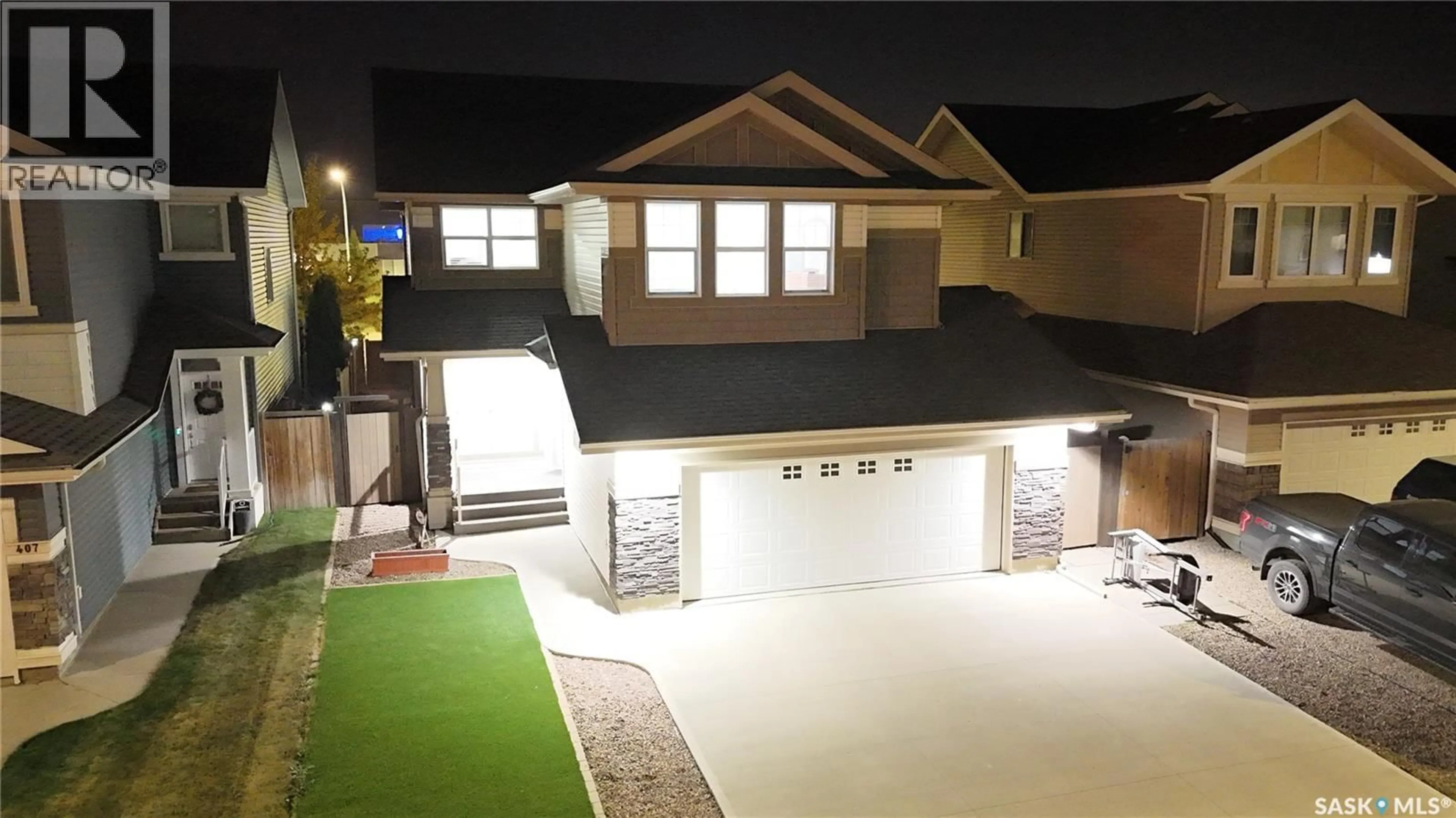 A pic from outside/outdoor area/front of a property/back of a property/a pic from drone, street for 411 FLYNN LANE, Saskatoon Saskatchewan S7V0L1