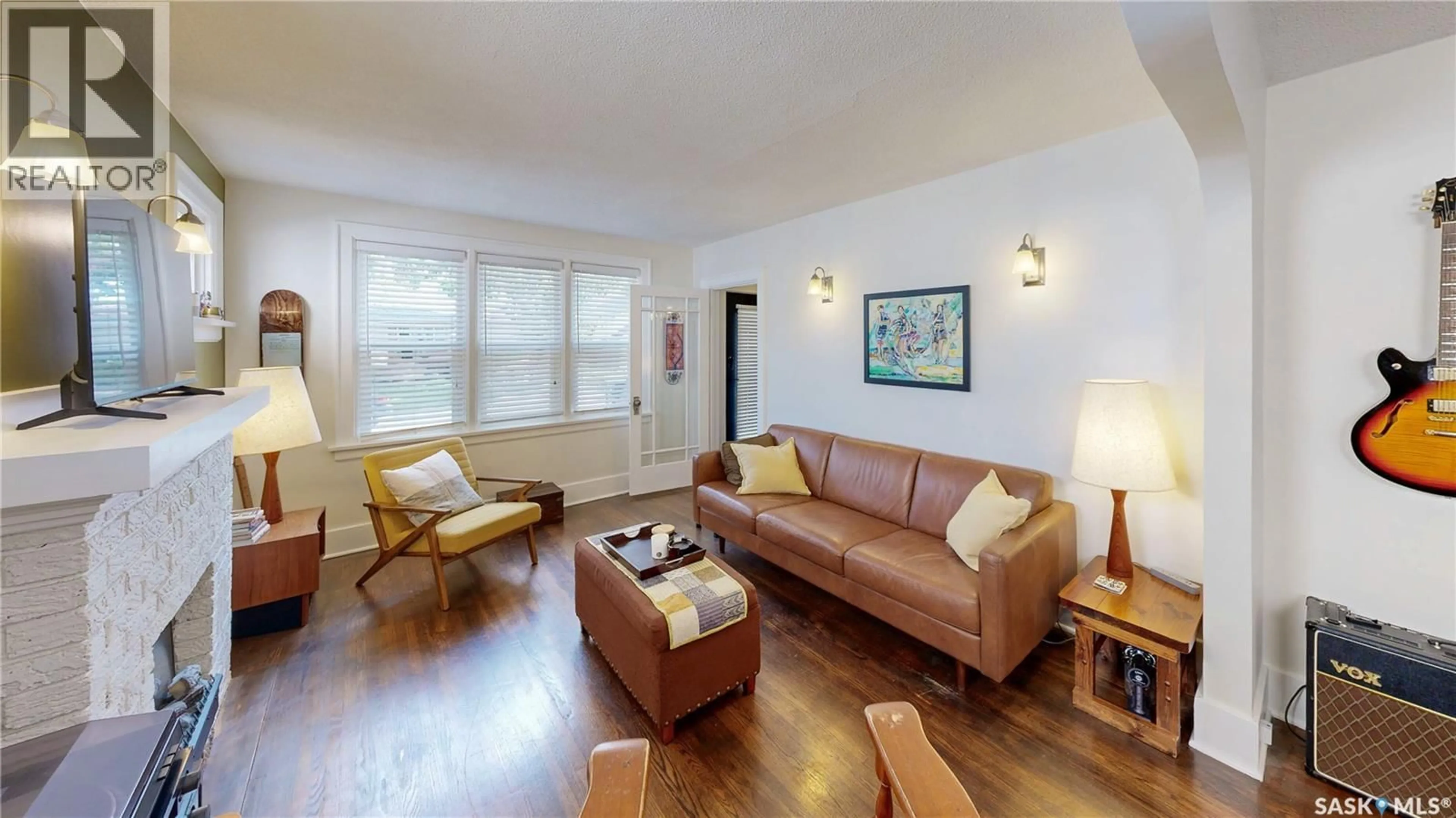 Living room with furniture, wood/laminate floor for 1040 MONTAGUE STREET, Regina Saskatchewan S4T3H5
