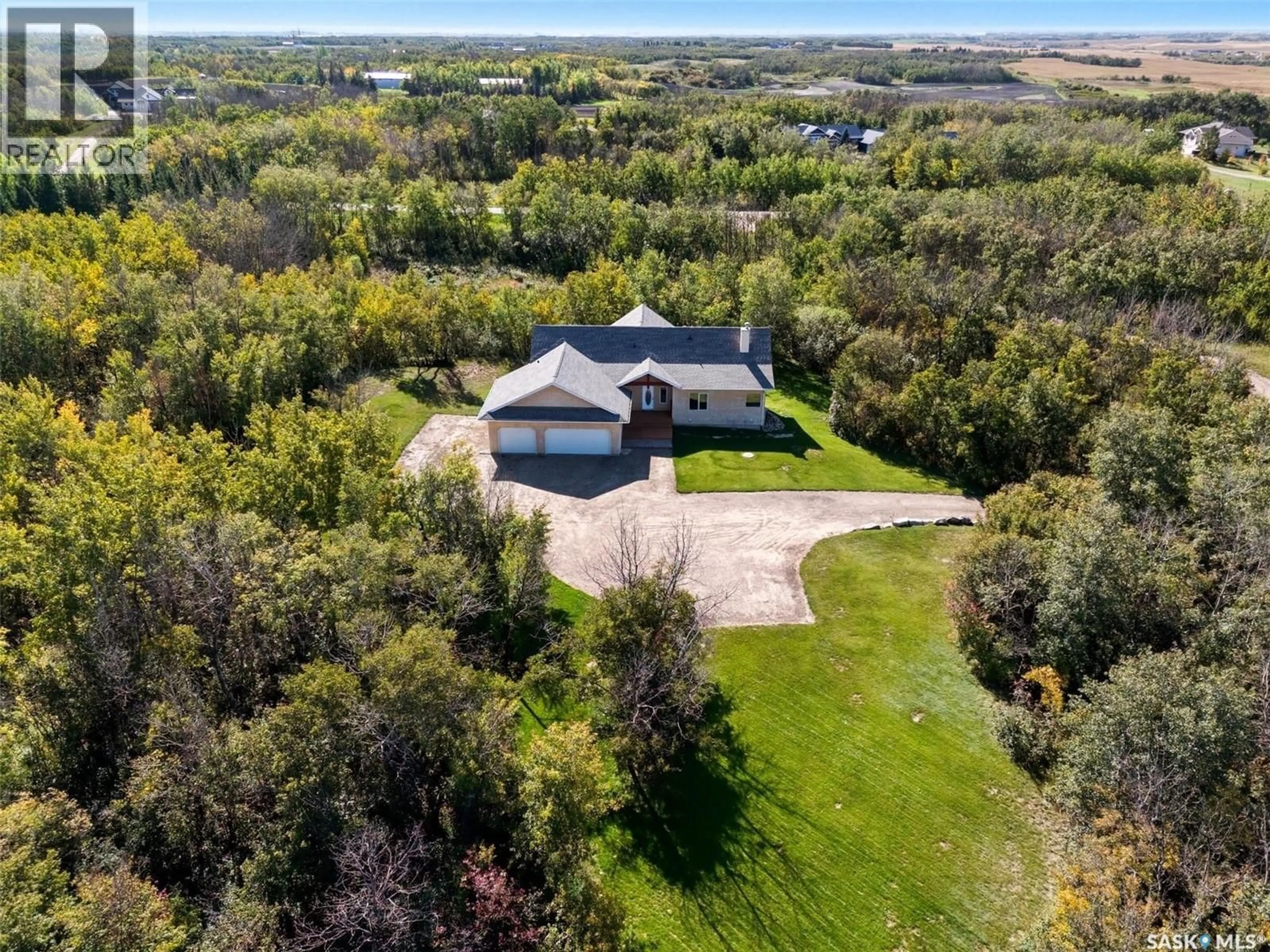 A pic from outside/outdoor area/front of a property/back of a property/a pic from drone, water/lake/river/ocean view for 25 DISCOVERY ROAD, Corman Park Rm No. 344 Saskatchewan S7K3J9