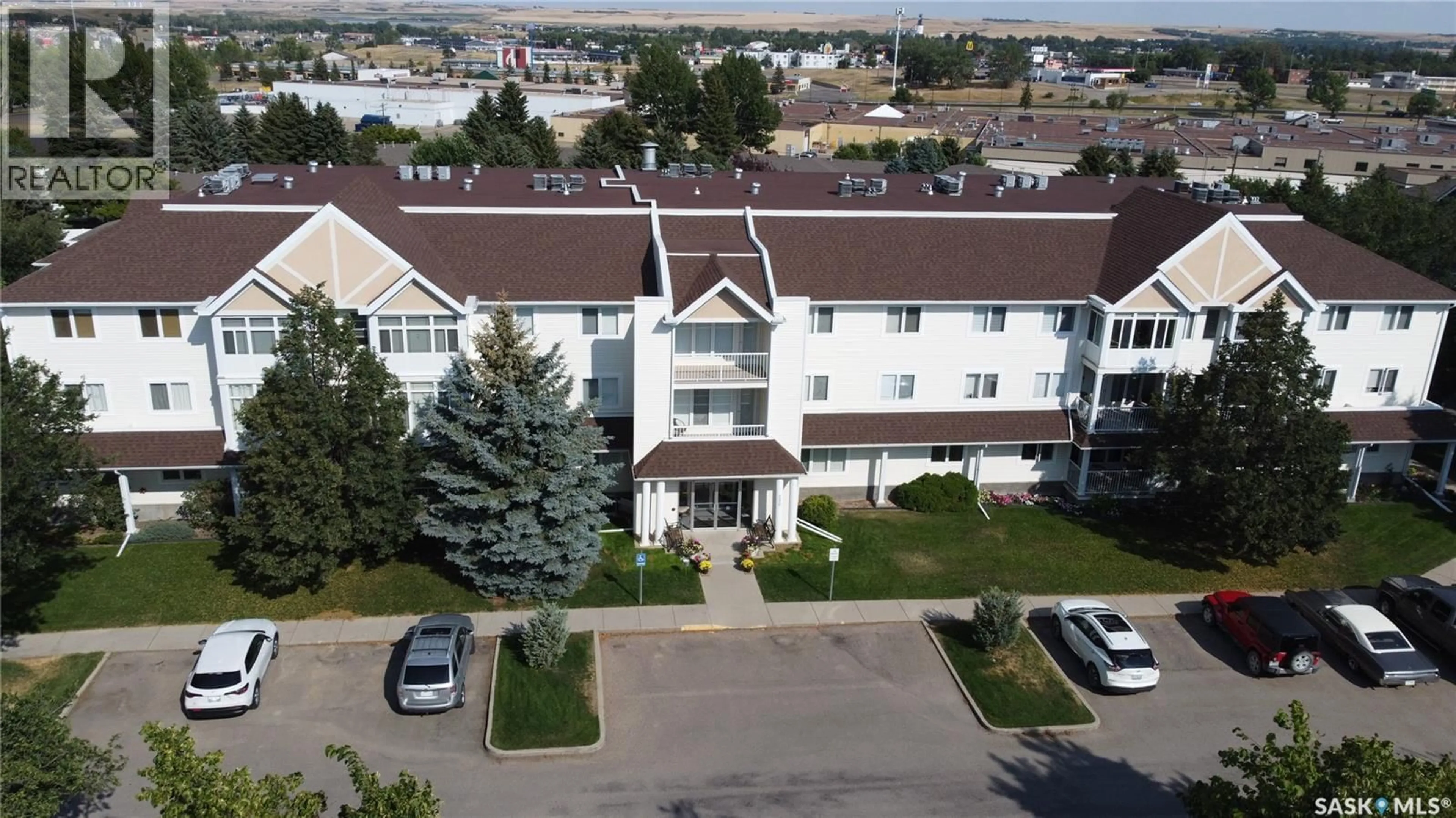 A pic from outside/outdoor area/front of a property/back of a property/a pic from drone, unknown for 307 230 LISTER KAYE CRESCENT, Swift Current Saskatchewan S9H0A2