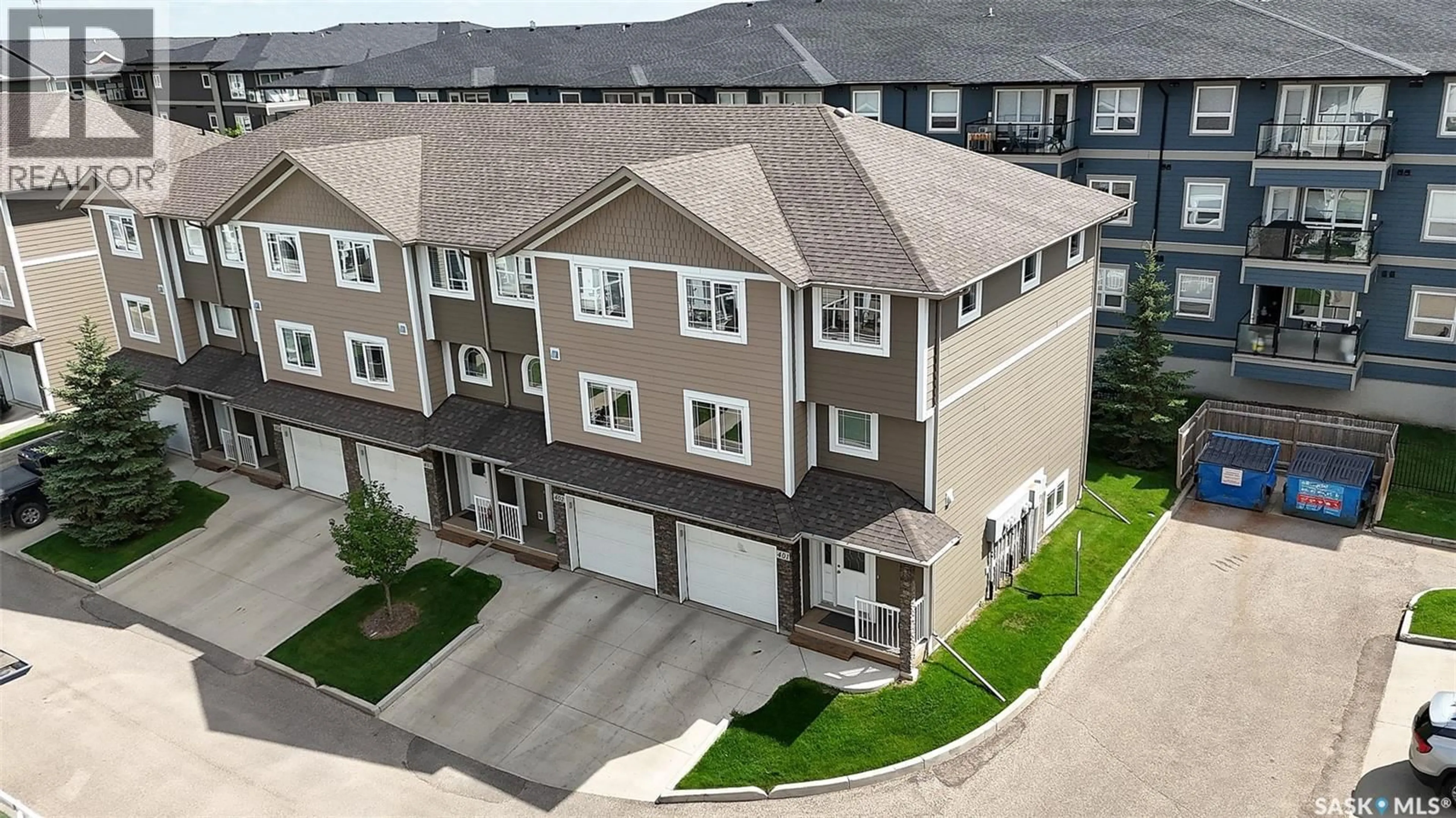 A pic from outside/outdoor area/front of a property/back of a property/a pic from drone, street for 401 212 WILLIS CRESCENT, Saskatoon Saskatchewan S7T0R7