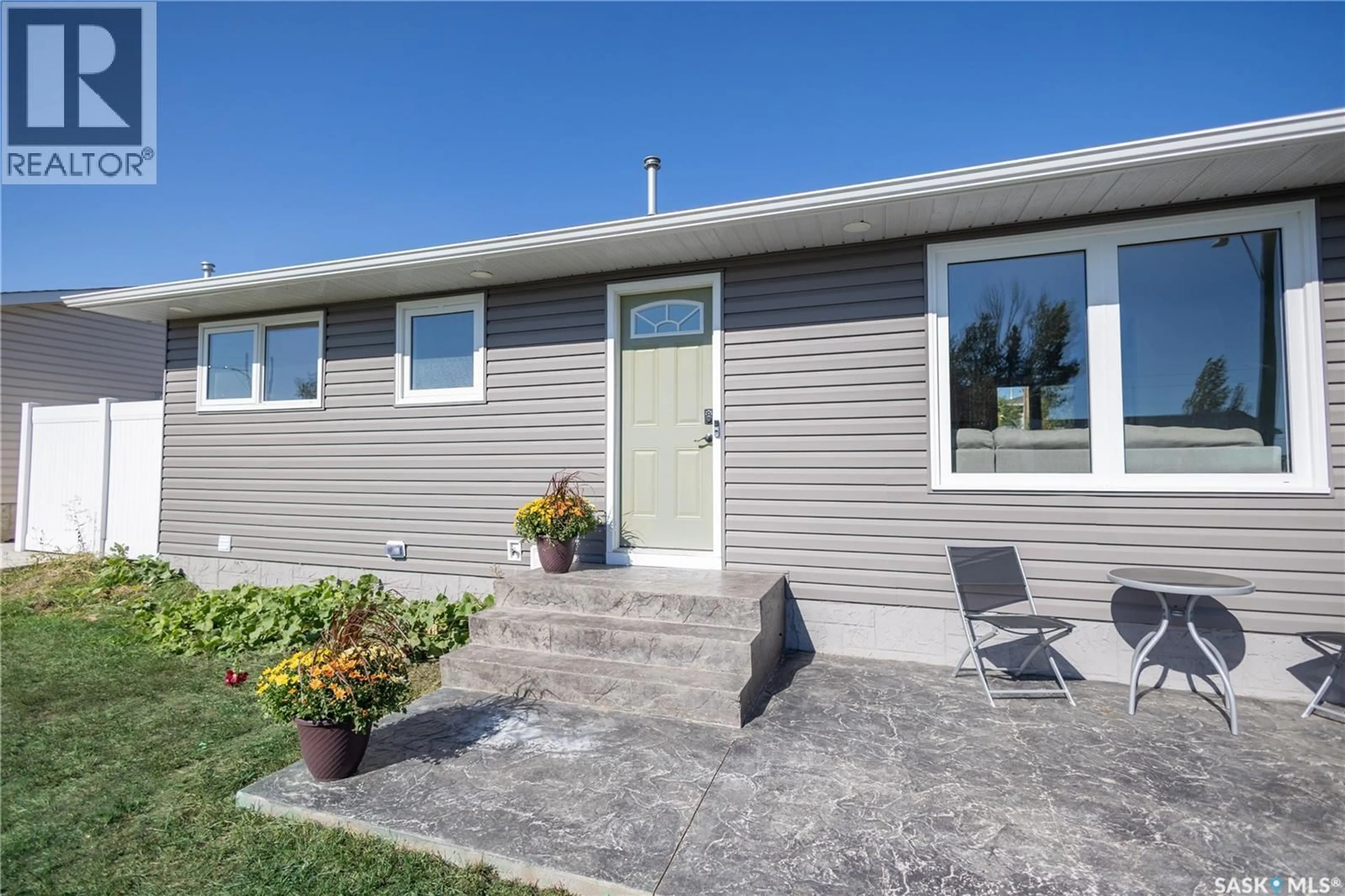 Home with vinyl exterior material, street for 1308 STADACONA STREET, Moose Jaw Saskatchewan S6H6M9