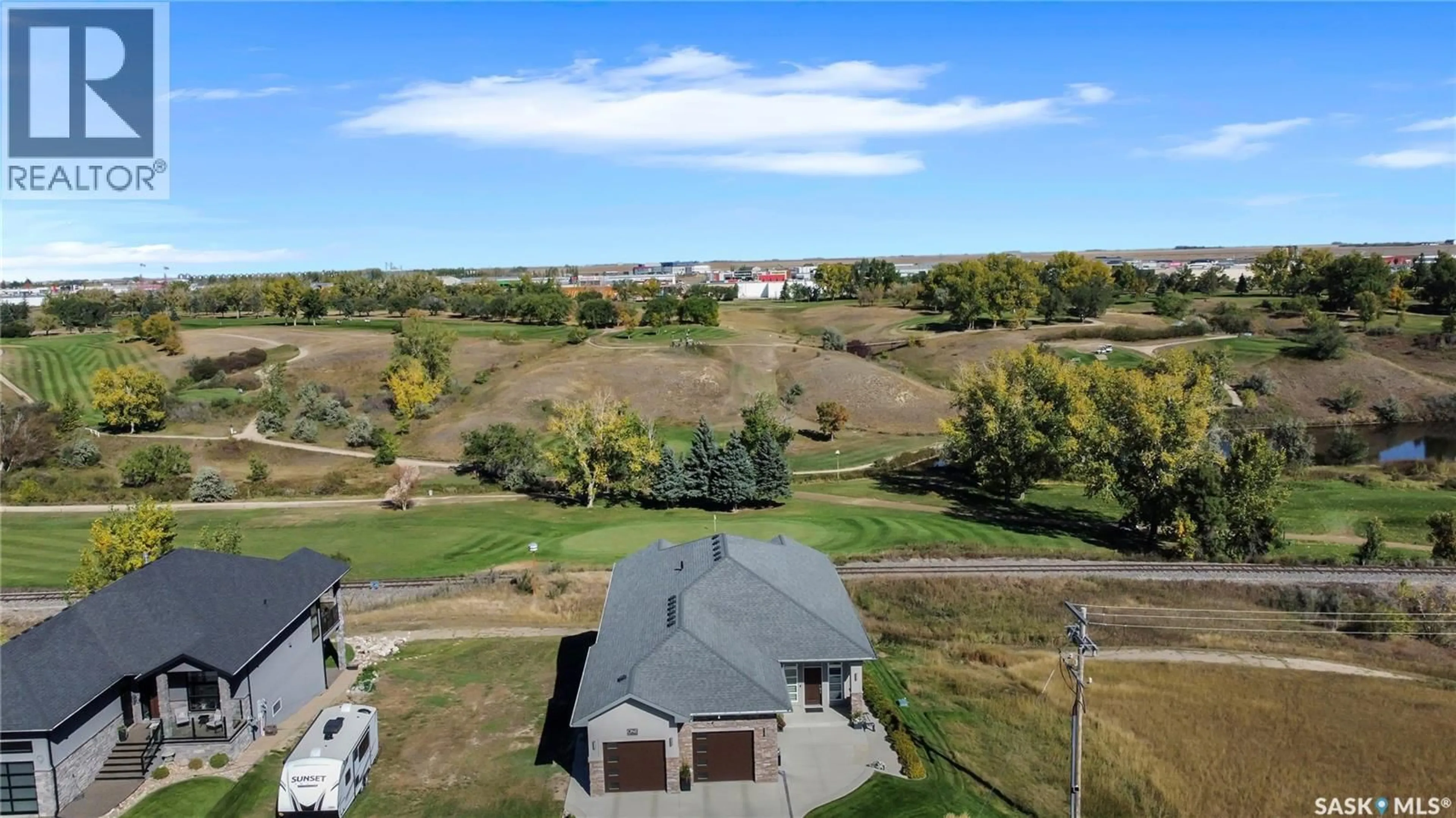 A pic from outside/outdoor area/front of a property/back of a property/a pic from drone, water/lake/river/ocean view for 1 COPPER RIDGE WAY, Moose Jaw Saskatchewan S6H4R1