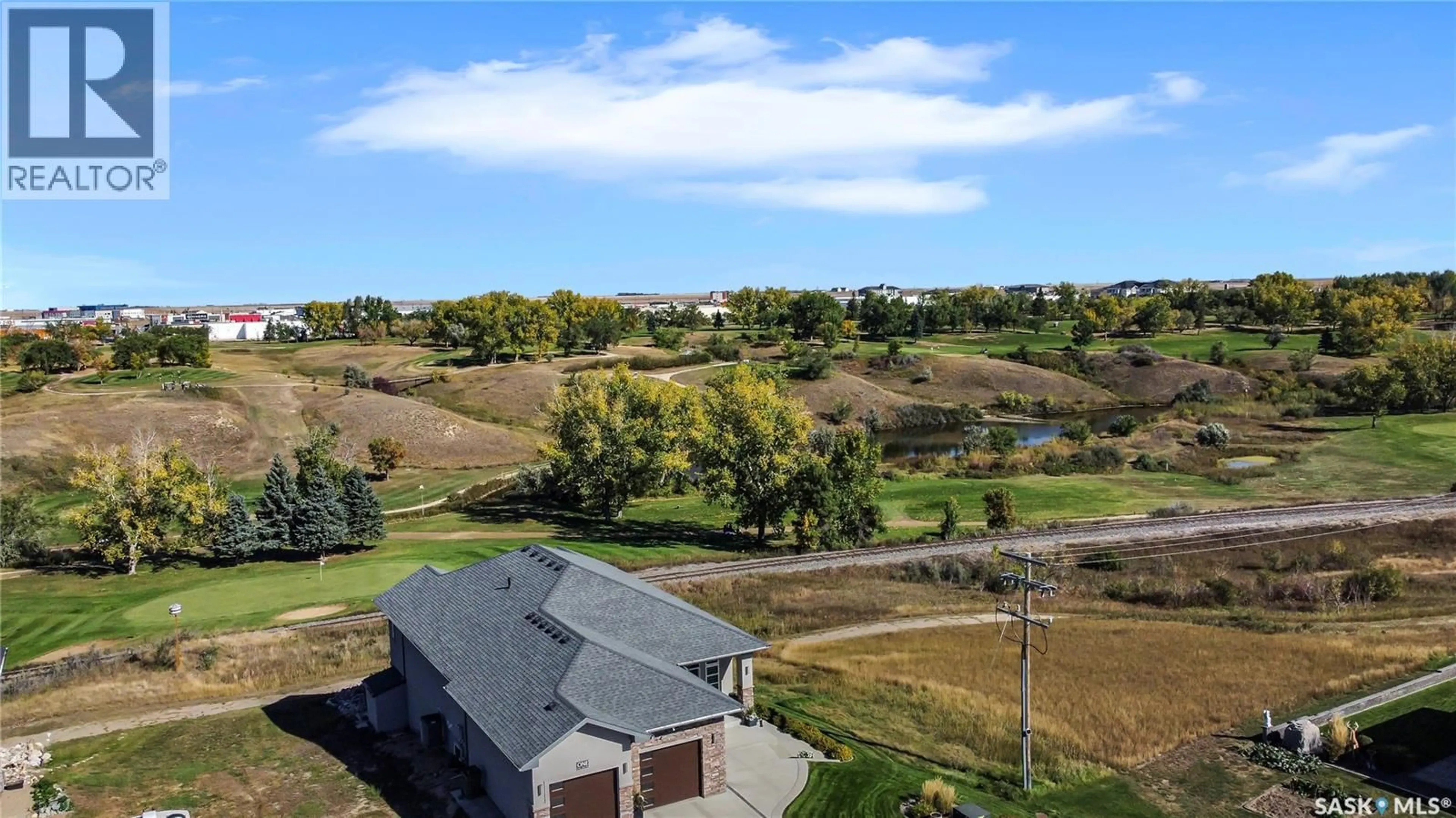 A pic from outside/outdoor area/front of a property/back of a property/a pic from drone, water/lake/river/ocean view for 1 COPPER RIDGE WAY, Moose Jaw Saskatchewan S6H4R1