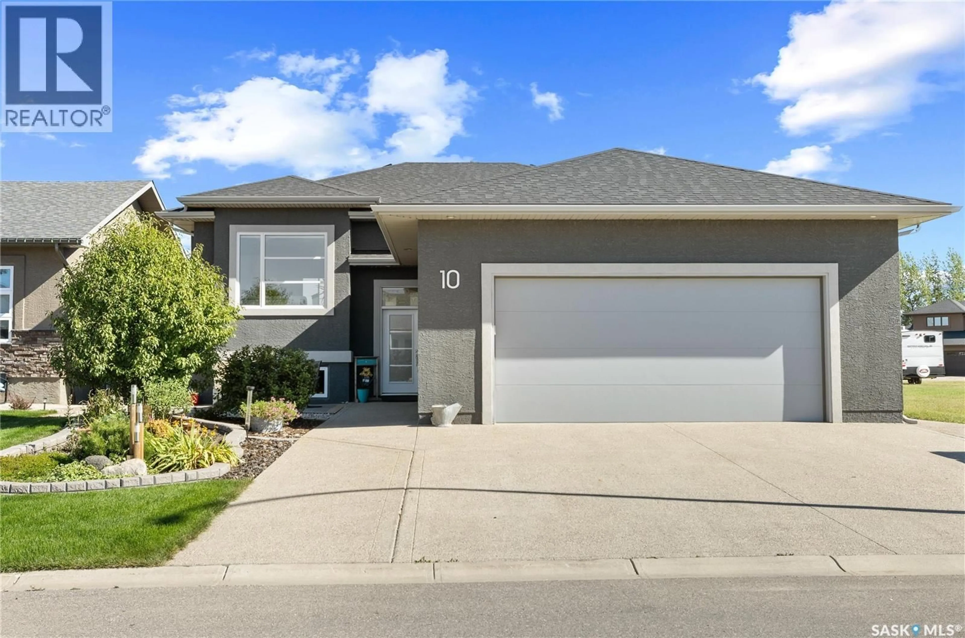 Home with vinyl exterior material, street for 10 DIEWOLD BAY, Balgonie Saskatchewan S0G0E0
