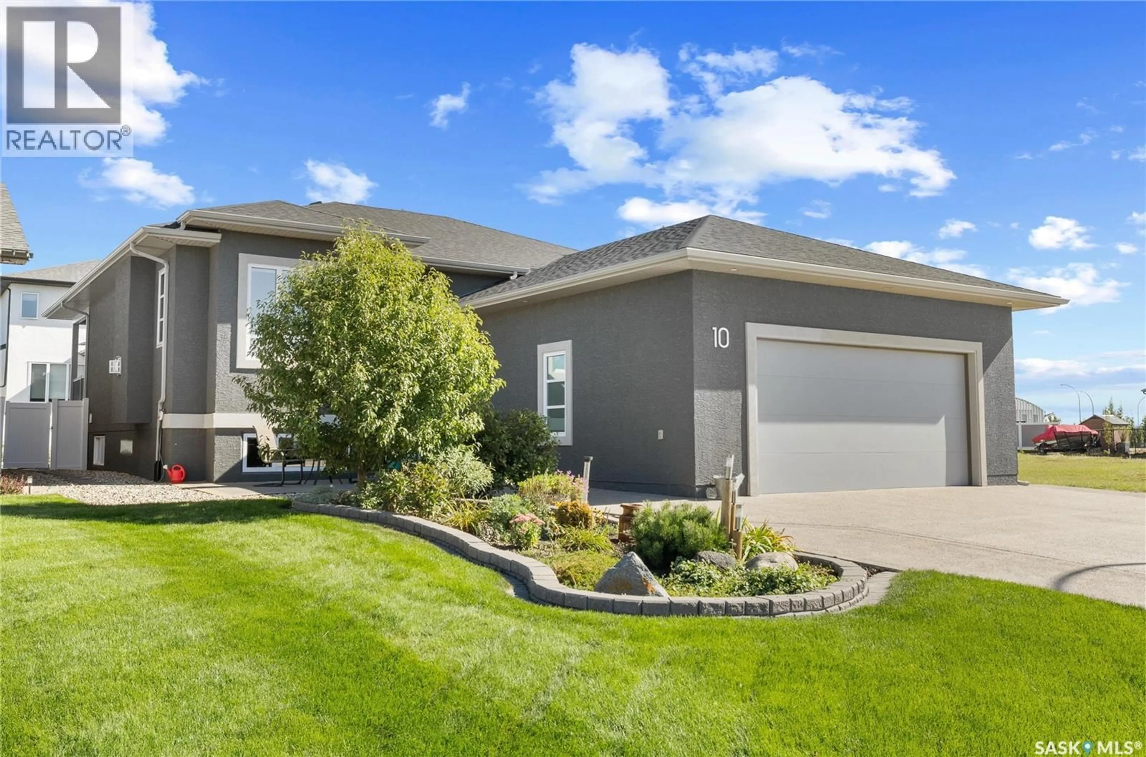 Home with vinyl exterior material, street for 10 DIEWOLD BAY, Balgonie Saskatchewan S0G0E0