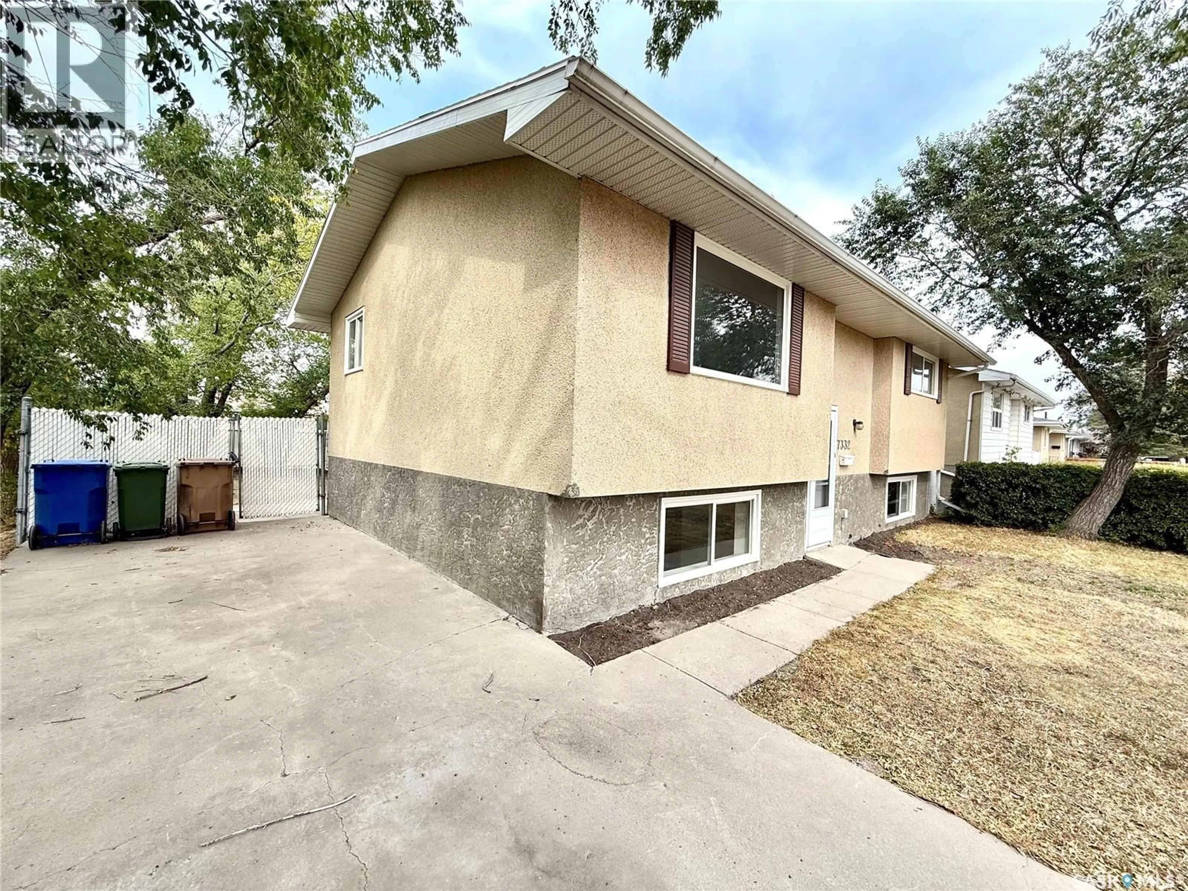 Home with vinyl exterior material, street for 7332 BOWMAN AVENUE, Regina Saskatchewan S4T6K8