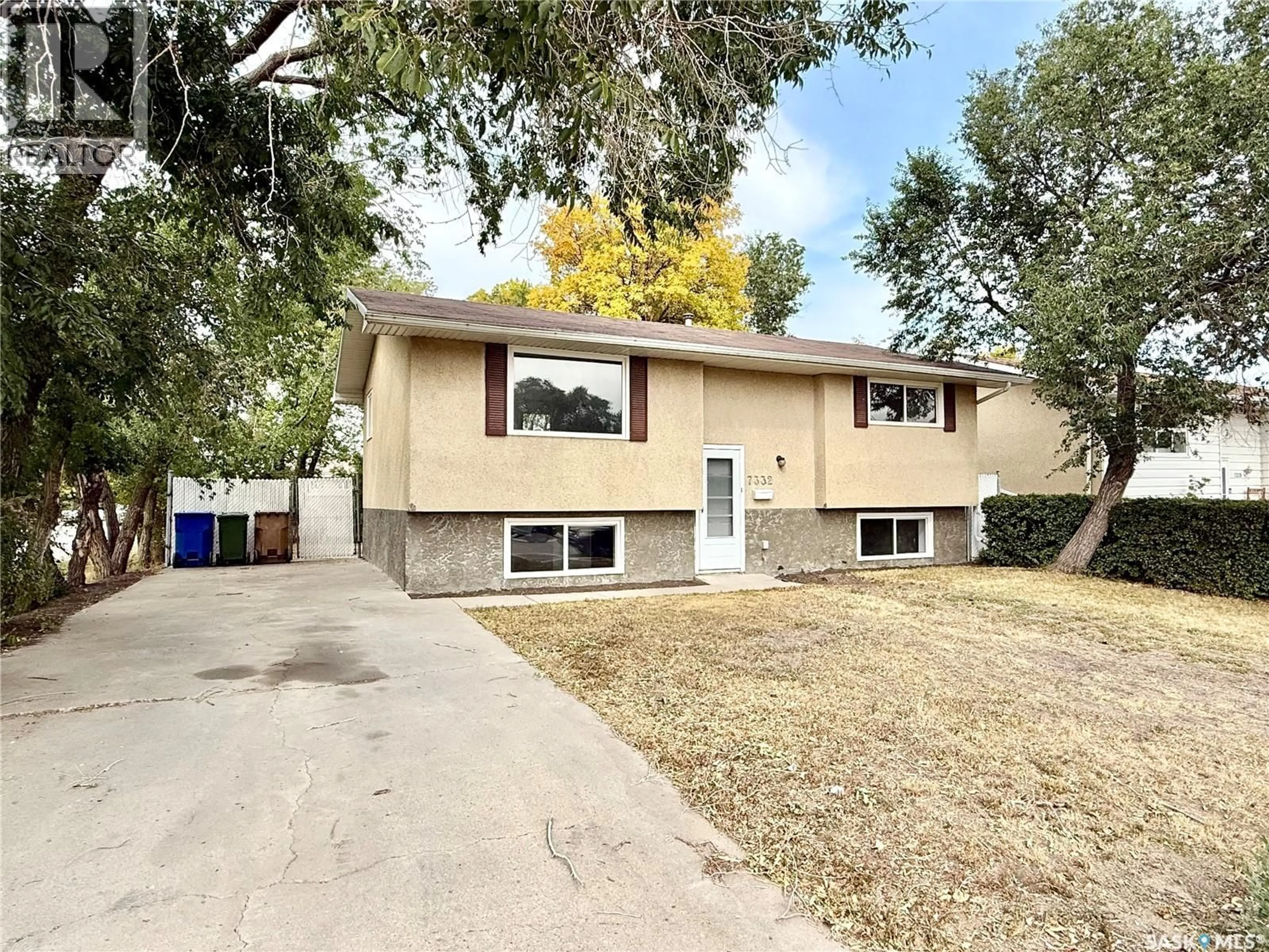 Home with vinyl exterior material, street for 7332 BOWMAN AVENUE, Regina Saskatchewan S4T6K8