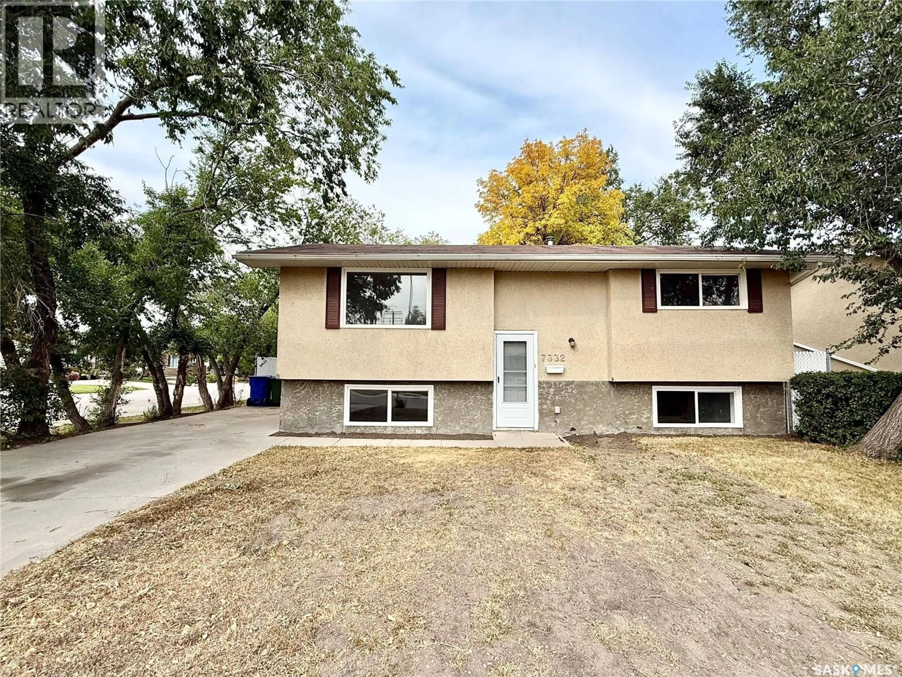 Home with vinyl exterior material, street for 7332 BOWMAN AVENUE, Regina Saskatchewan S4T6K8