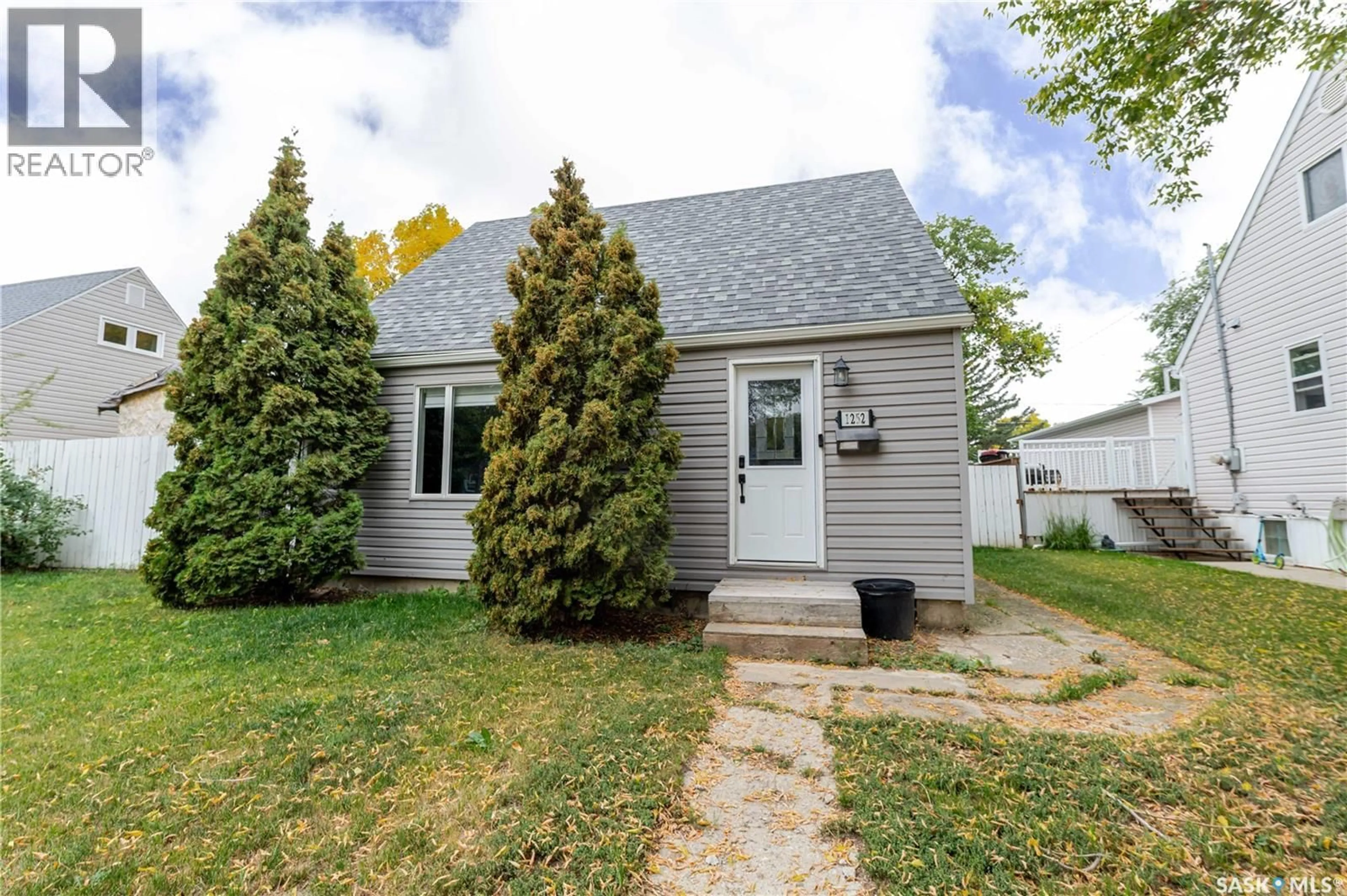 Home with vinyl exterior material, street for 1252 4TH AVENUE, Moose Jaw Saskatchewan S6H1J5