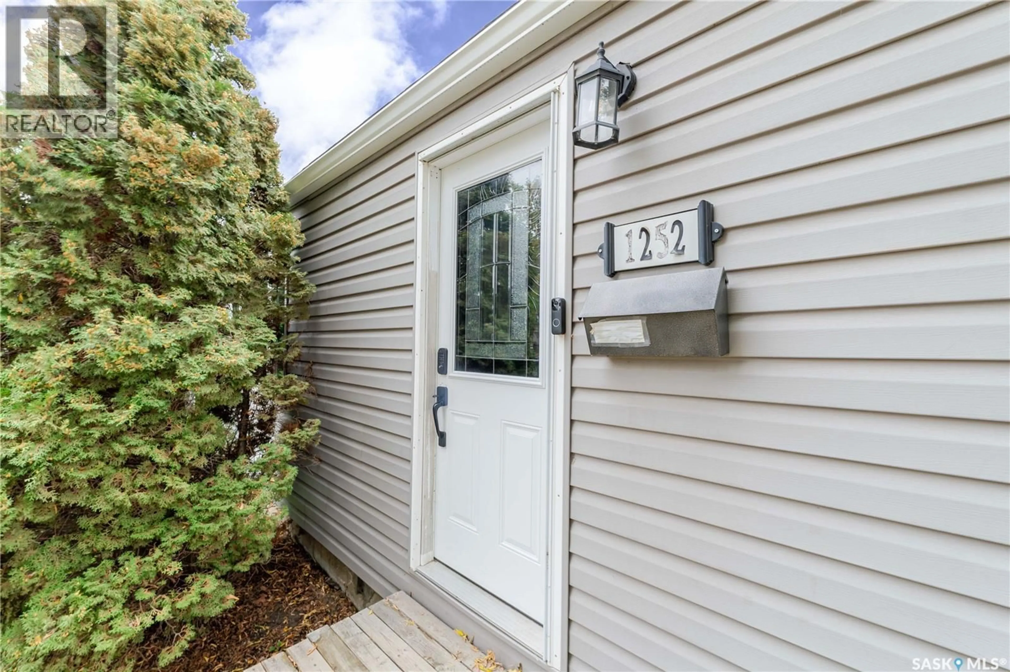 Home with vinyl exterior material, street for 1252 4TH AVENUE, Moose Jaw Saskatchewan S6H1J5