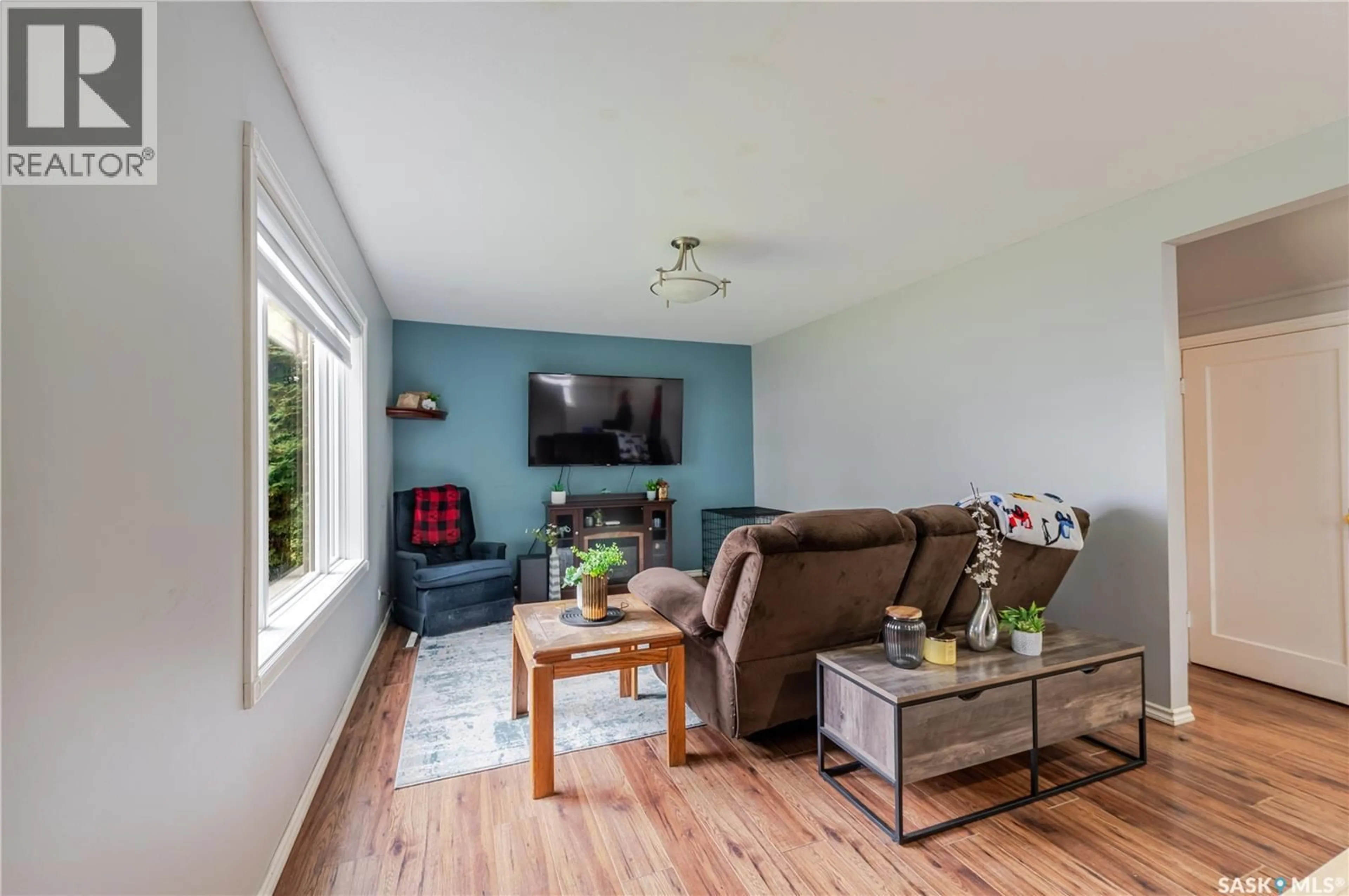Living room with furniture, wood/laminate floor for 1252 4TH AVENUE, Moose Jaw Saskatchewan S6H1J5