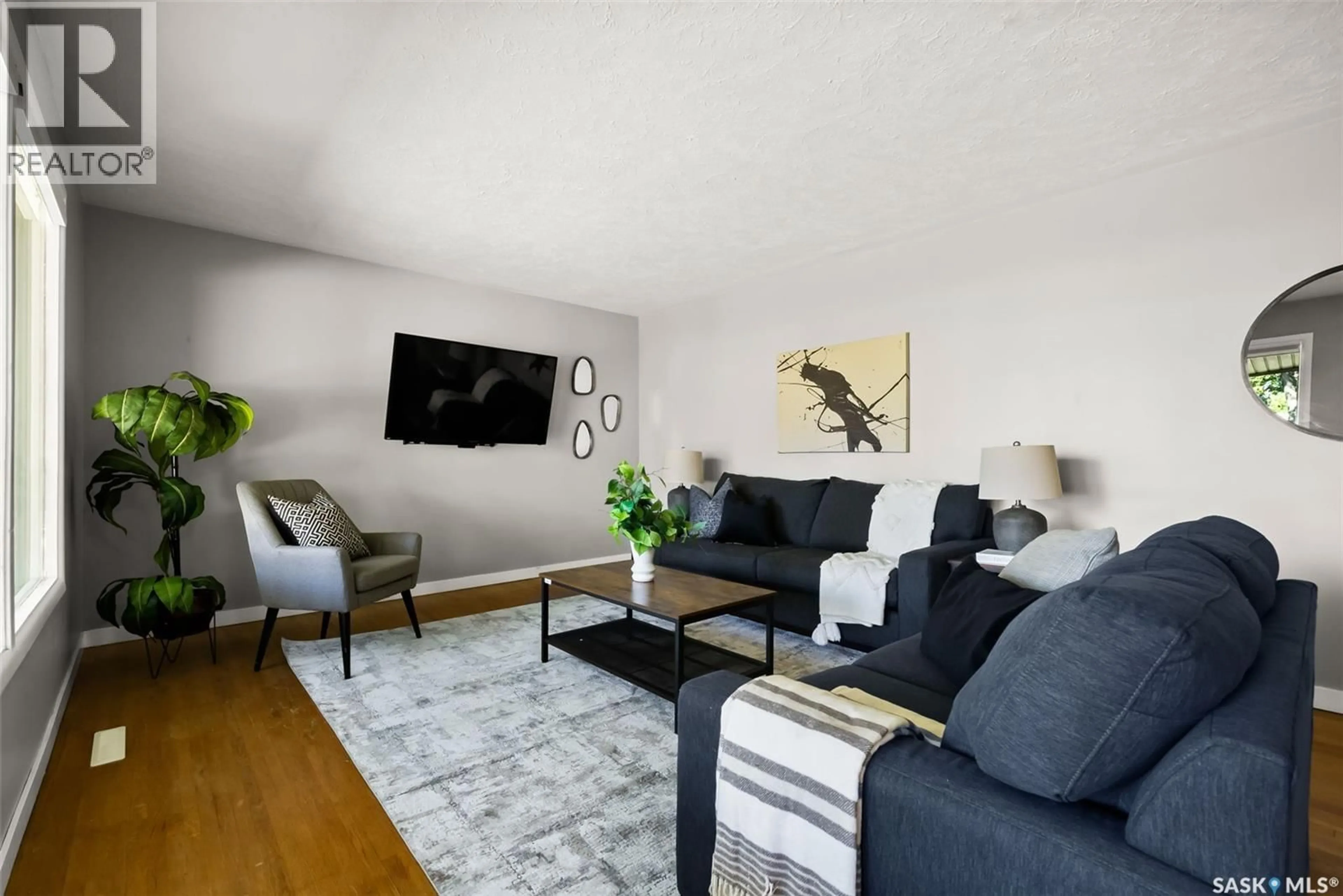 Living room with furniture, wood/laminate floor for 45 DARKE CRESCENT, Regina Saskatchewan S4S2W5