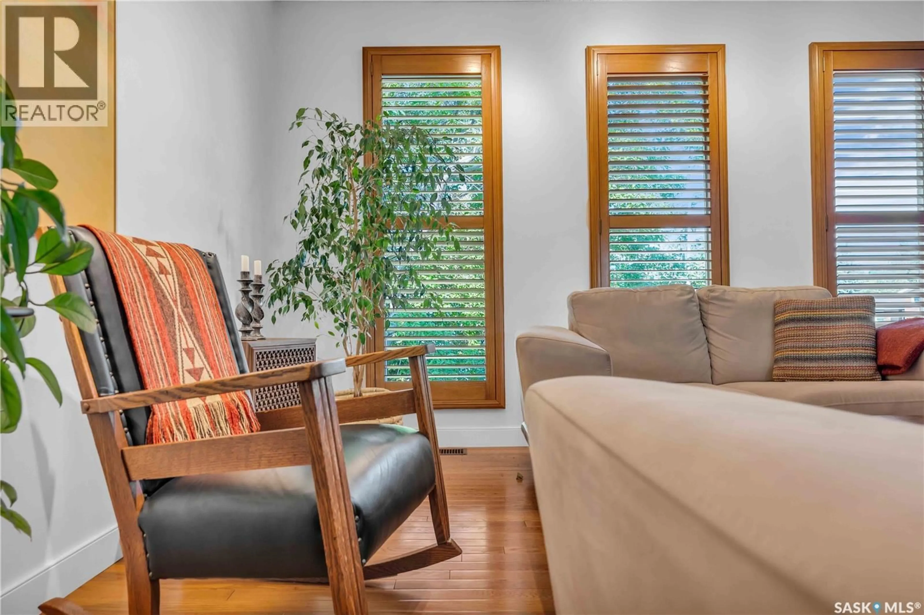 Living room with furniture, wood/laminate floor for 623 PRIEL CRESCENT, Saskatoon Saskatchewan S7M4K9
