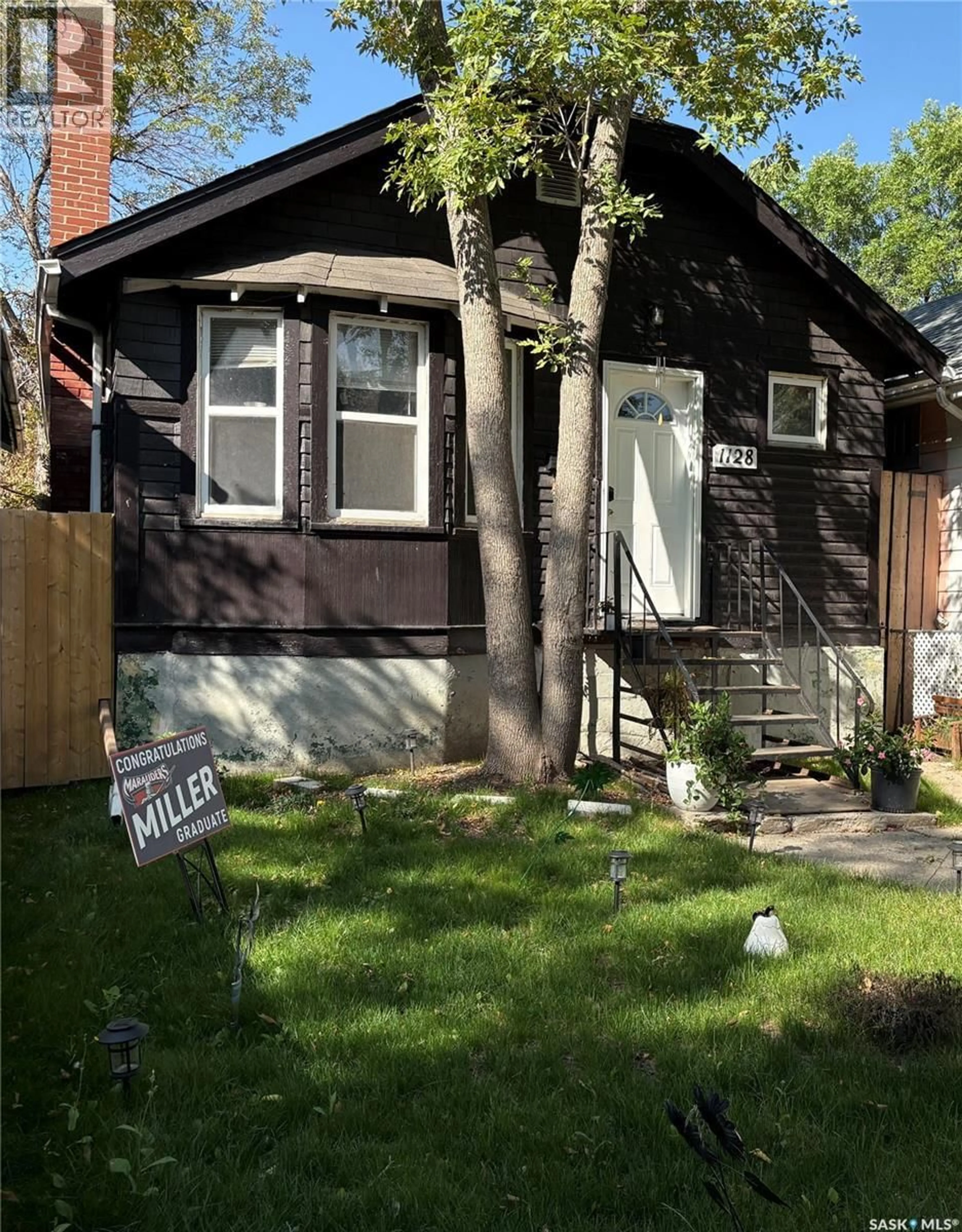 Home with vinyl exterior material, street for 1128 GARNET STREET, Regina Saskatchewan S4T2X8
