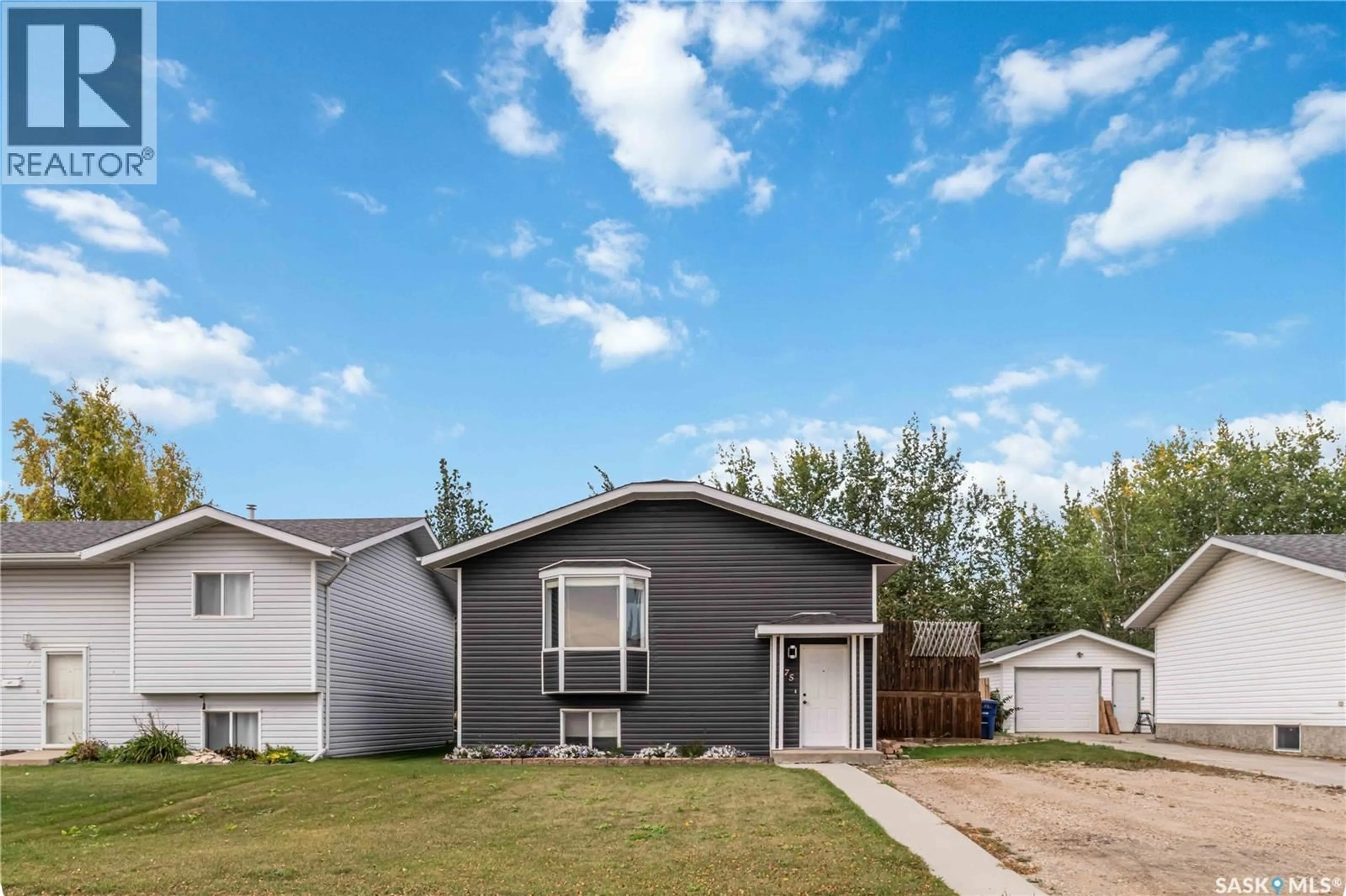 Home with vinyl exterior material, street for 75 3RD STREET, Humboldt Saskatchewan S0K2A0