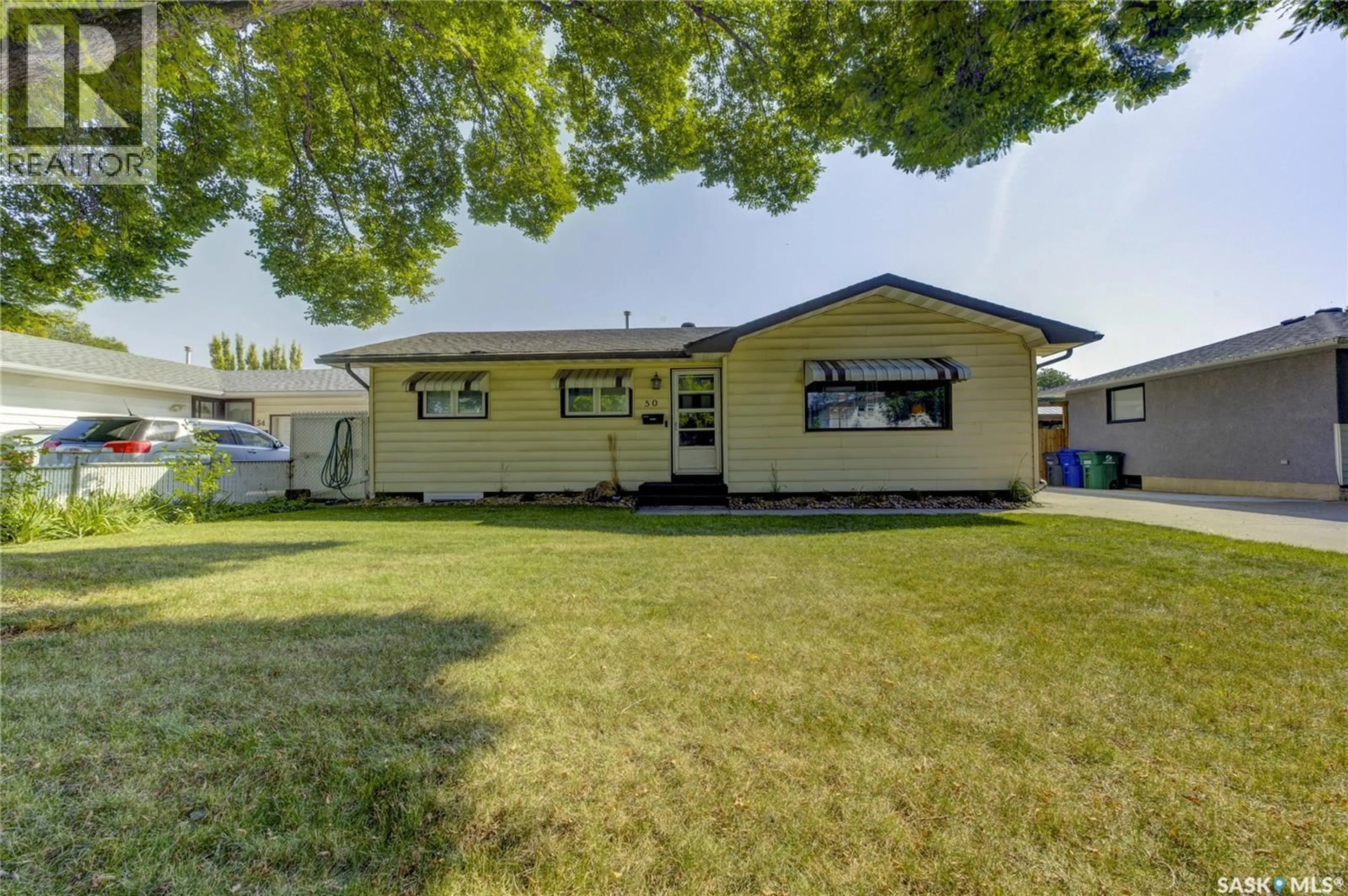 Home with vinyl exterior material, street for 50 RUPERT DRIVE, Saskatoon Saskatchewan S7K1B3