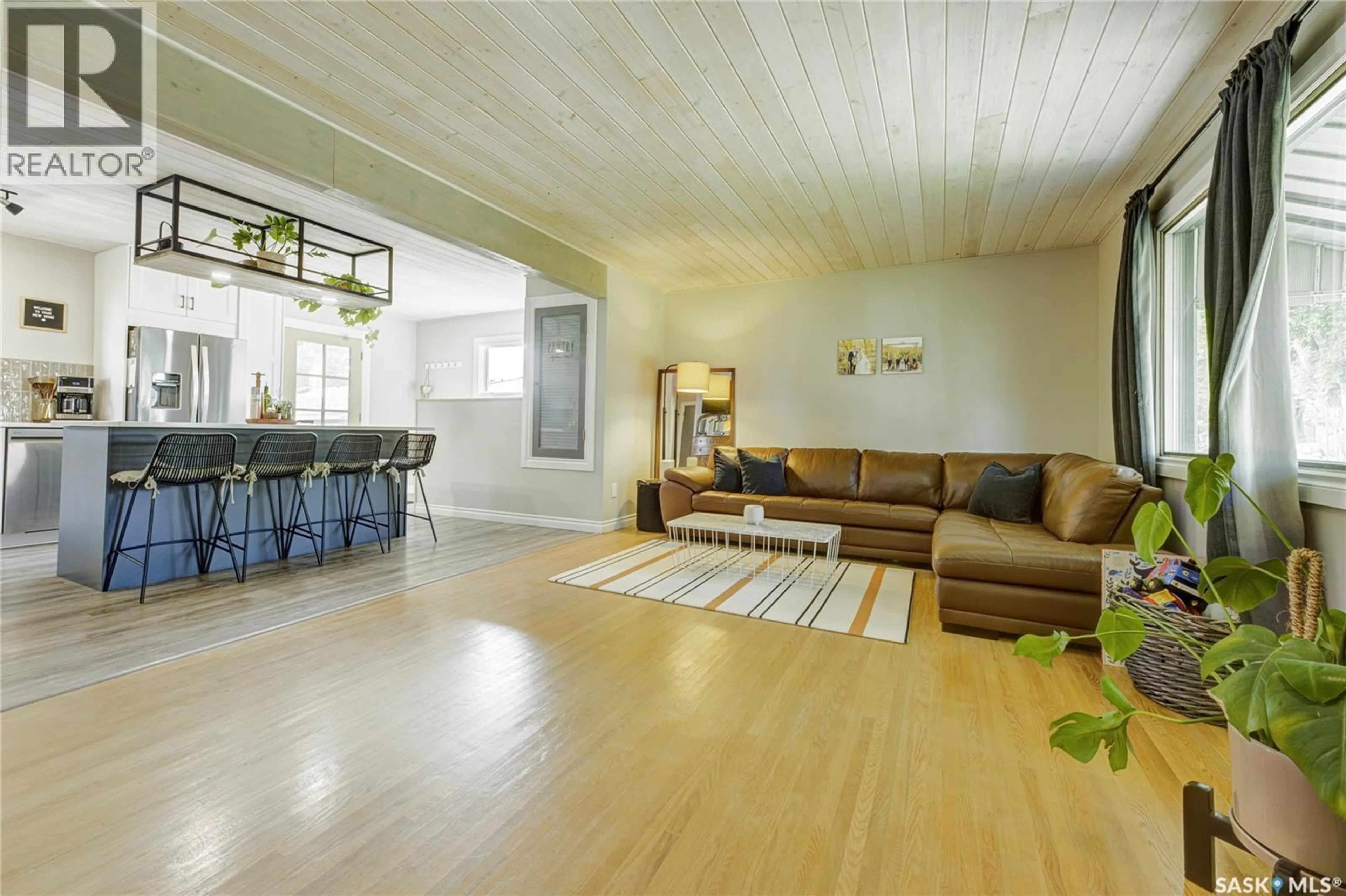 Living room with furniture, wood/laminate floor for 50 RUPERT DRIVE, Saskatoon Saskatchewan S7K1B3