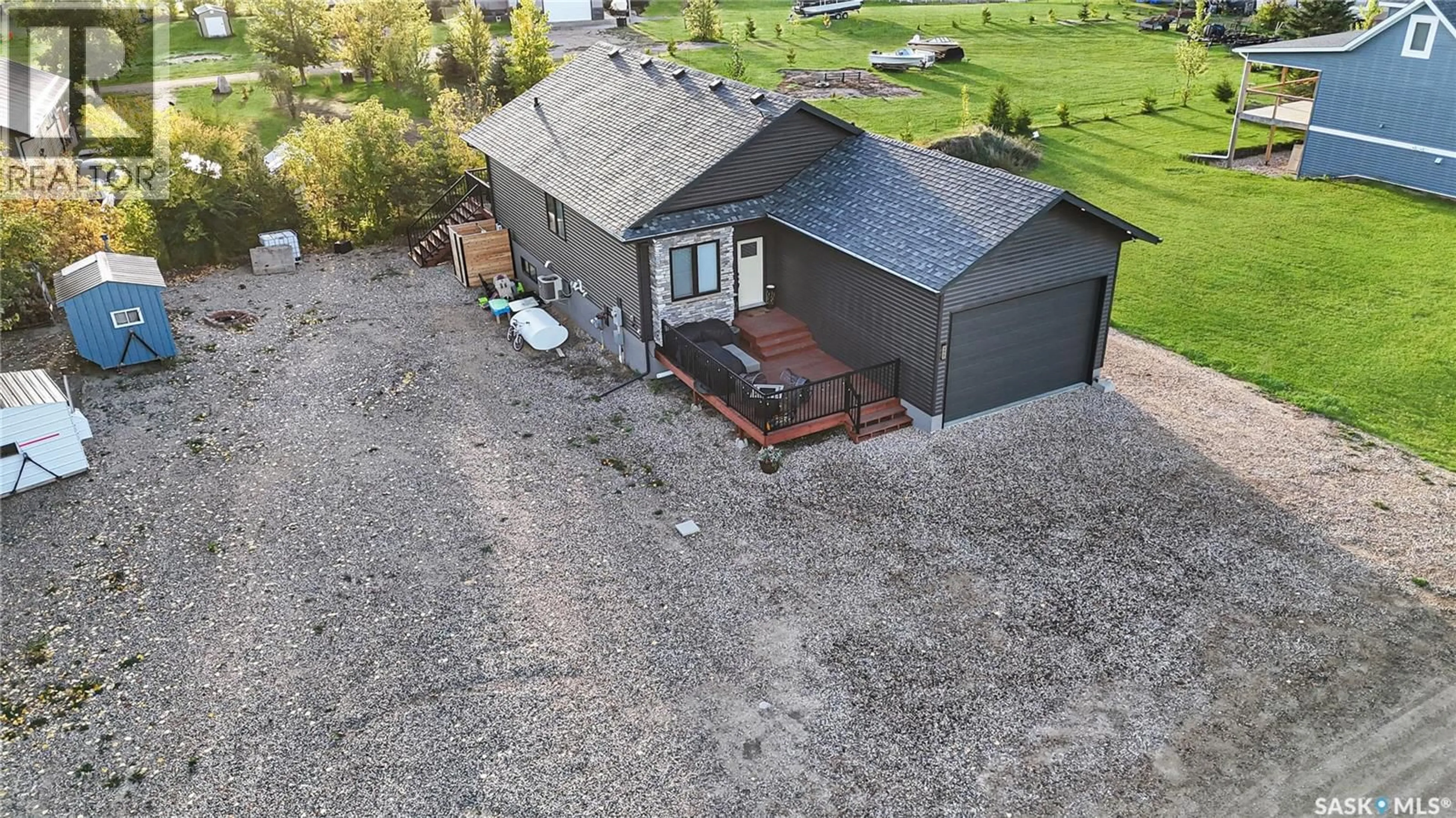 A pic from outside/outdoor area/front of a property/back of a property/a pic from drone, unknown for 403-404 PARK PLACE, Iroquois Lake Saskatchewan S0J2G0
