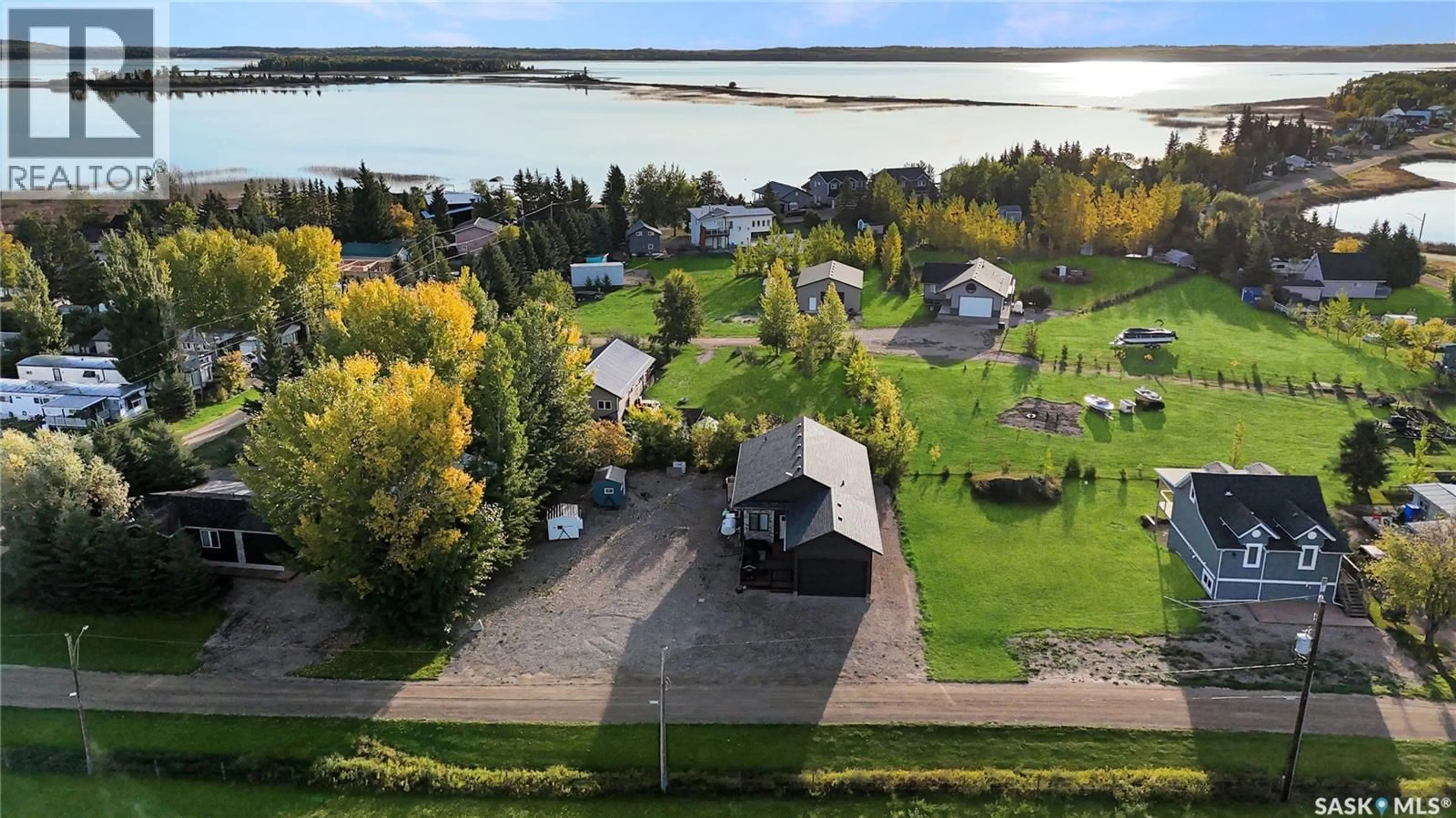 A pic from outside/outdoor area/front of a property/back of a property/a pic from drone, water/lake/river/ocean view for 403-404 PARK PLACE, Iroquois Lake Saskatchewan S0J2G0