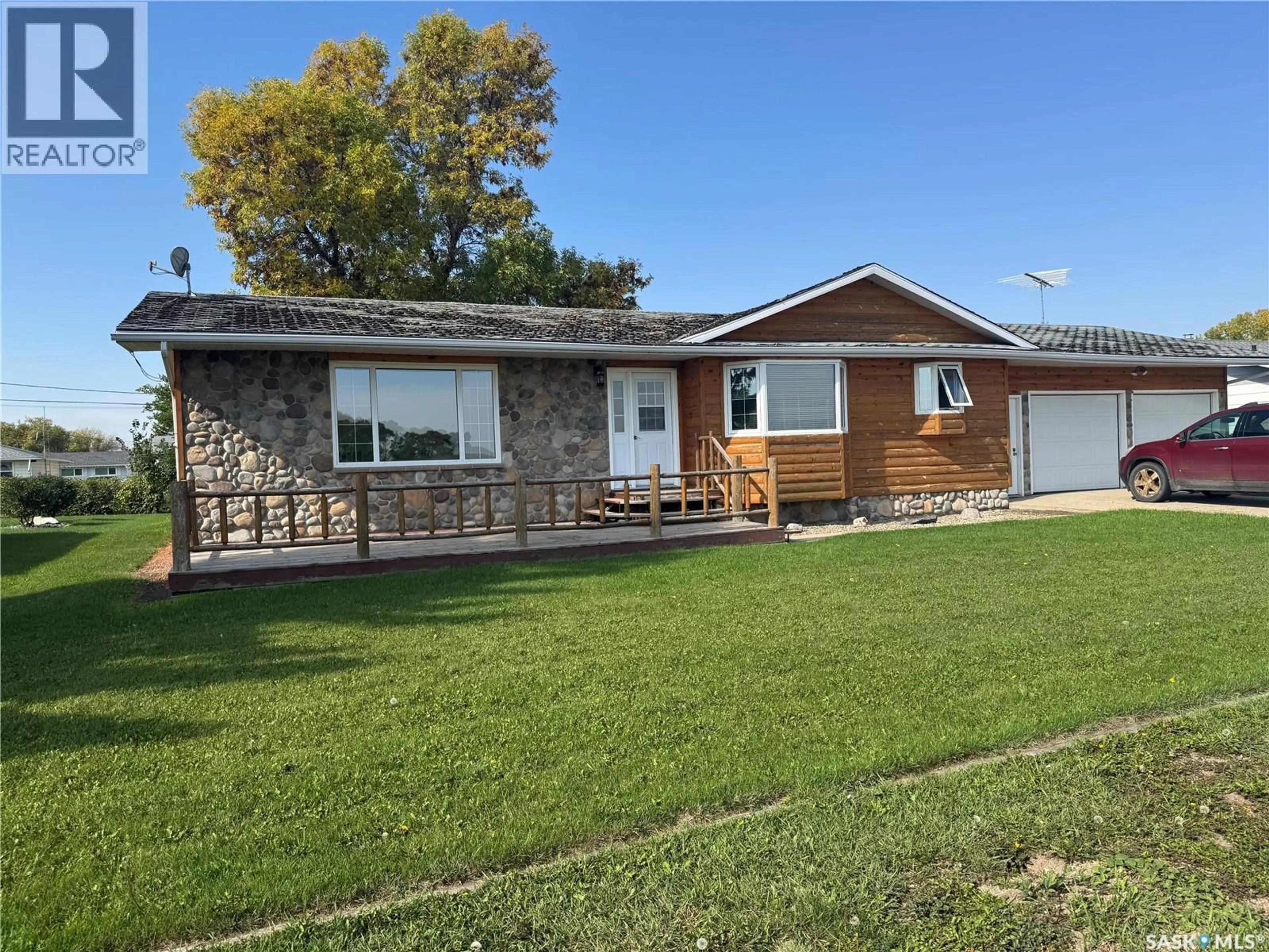 Home with vinyl exterior material, street for 203 MACDONALD STREET, Stockholm Saskatchewan S0A3Y0