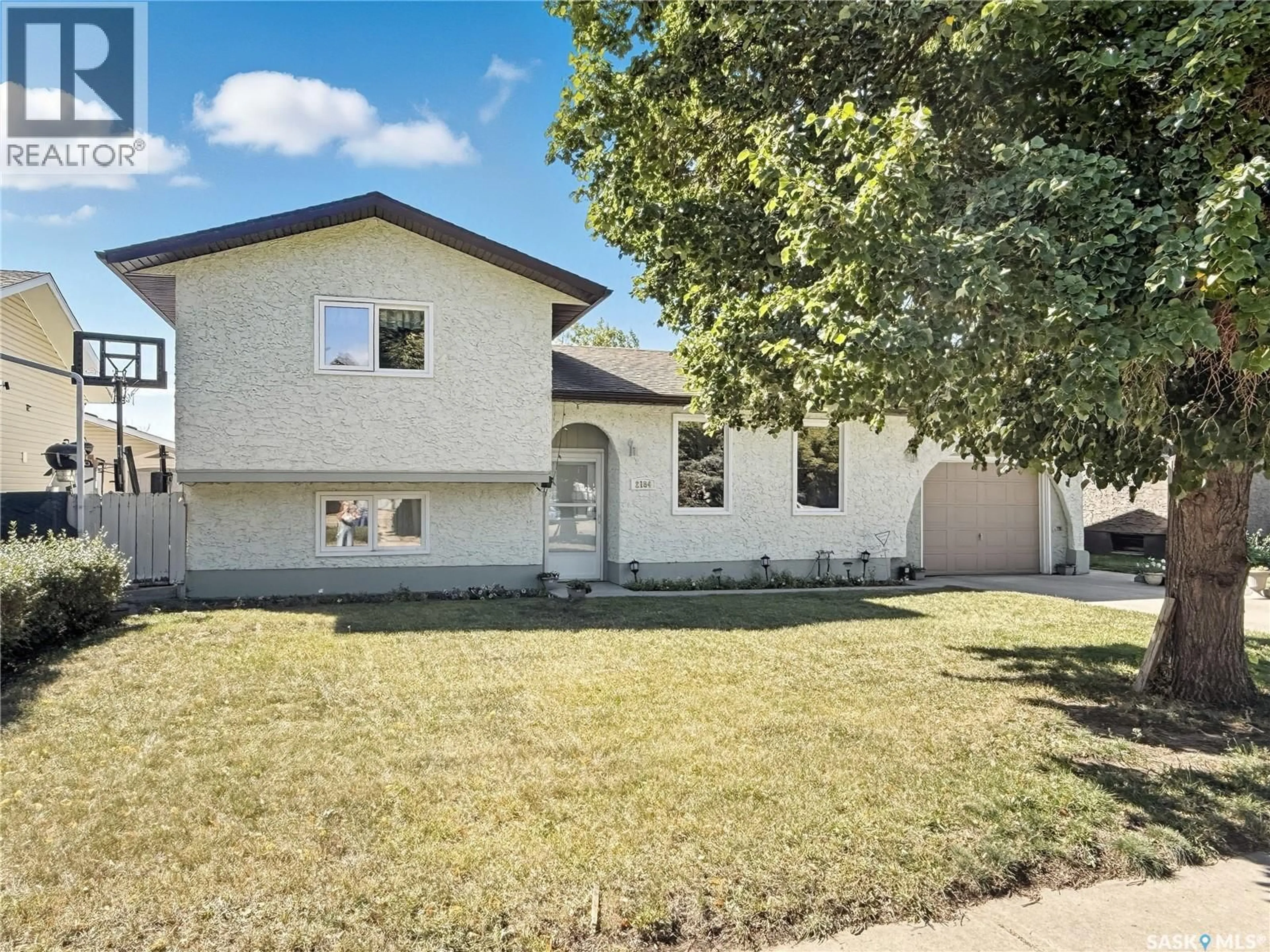 Home with vinyl exterior material, street for 2184 DOUGLAS AVENUE, North Battleford Saskatchewan S9A3A9
