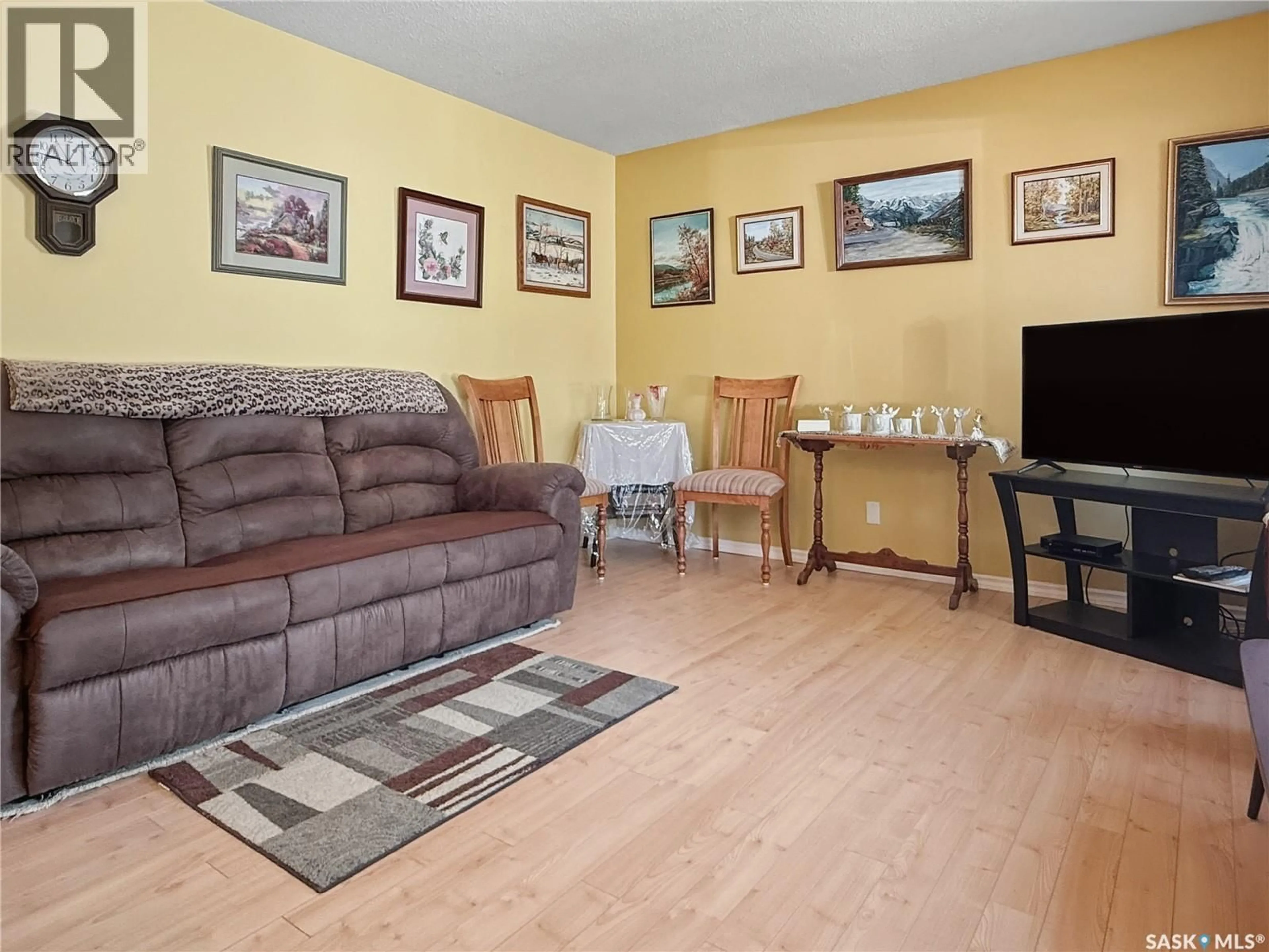 Living room with furniture, wood/laminate floor for 2184 DOUGLAS AVENUE, North Battleford Saskatchewan S9A3A9