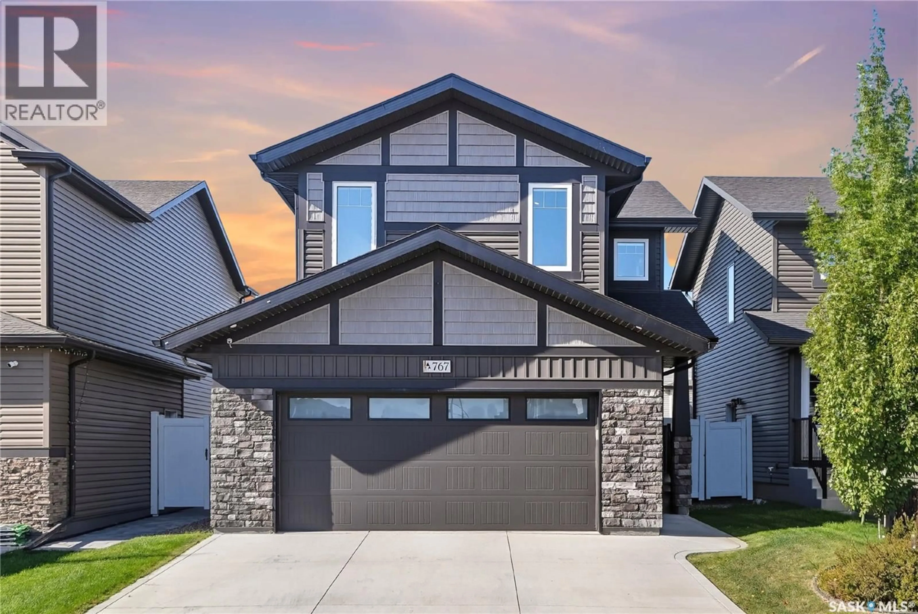 Home with brick exterior material, street for 767 MCFAULL LANE, Saskatoon Saskatchewan S7V0S8