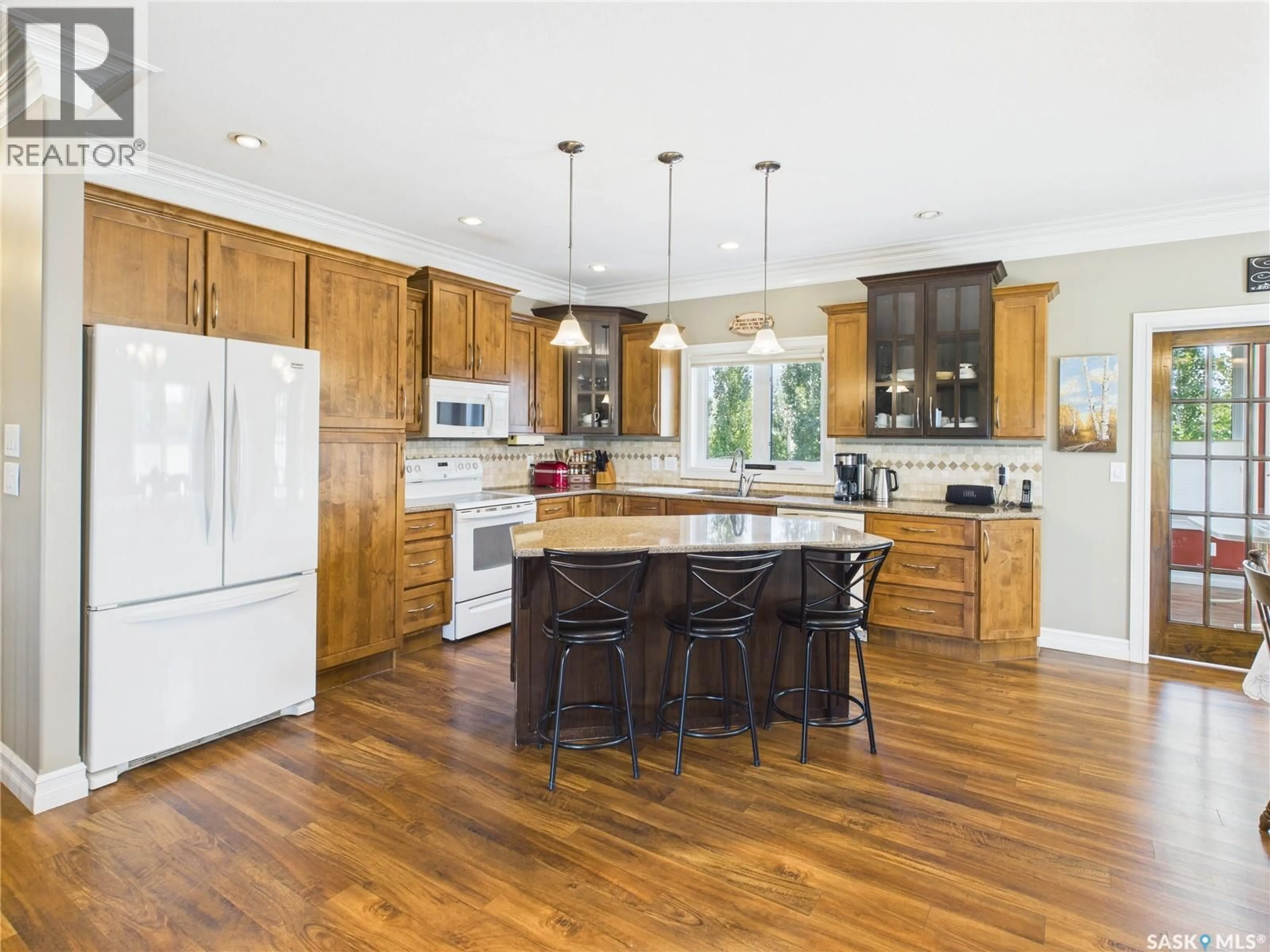 Open concept kitchen, wood/laminate floor for 100 2ND STREET, Birch Hills Saskatchewan S0J0G0
