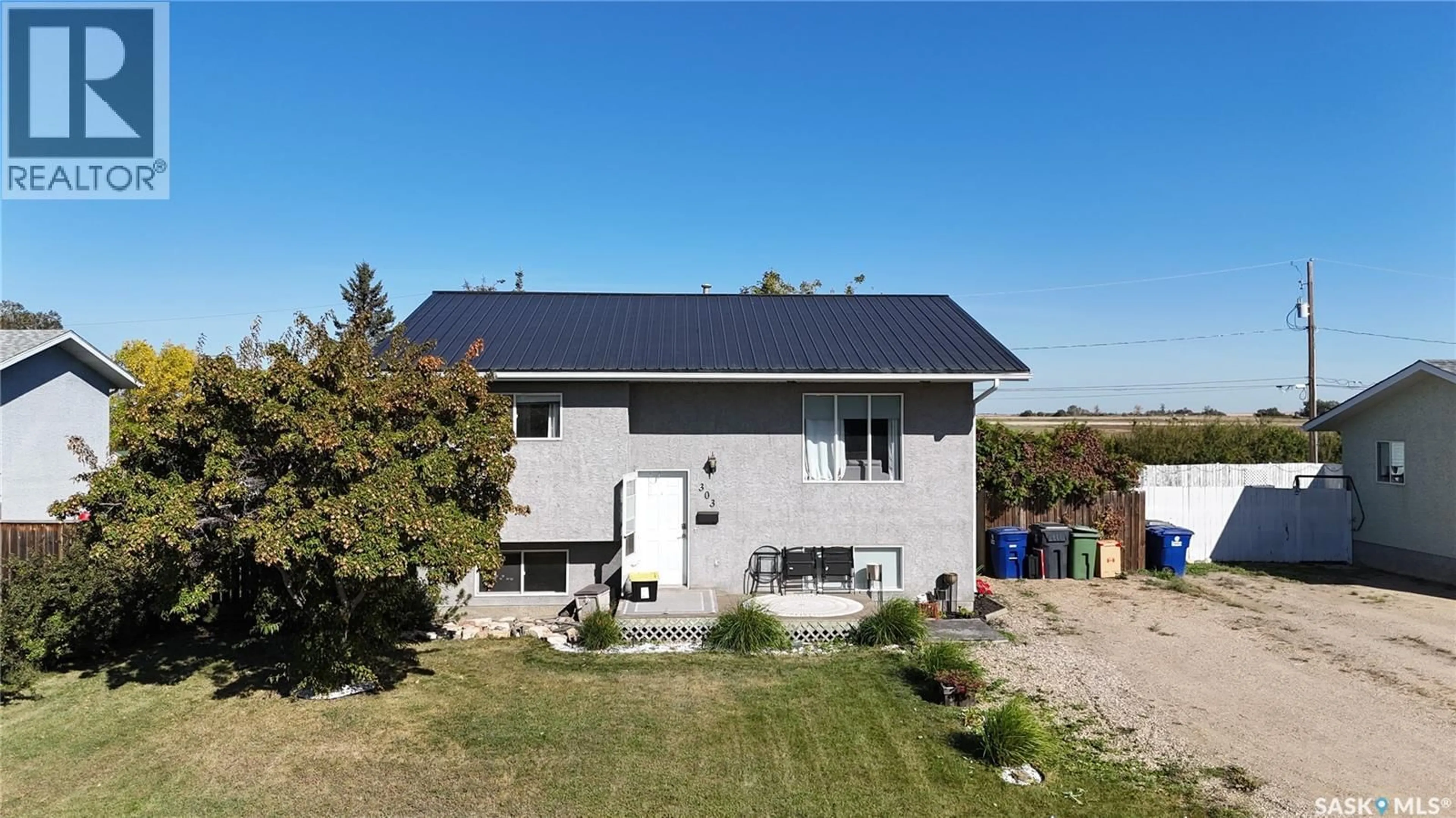 A pic from outside/outdoor area/front of a property/back of a property/a pic from drone, building for 303 4TH STREET, Dundurn Saskatchewan S0K1K0